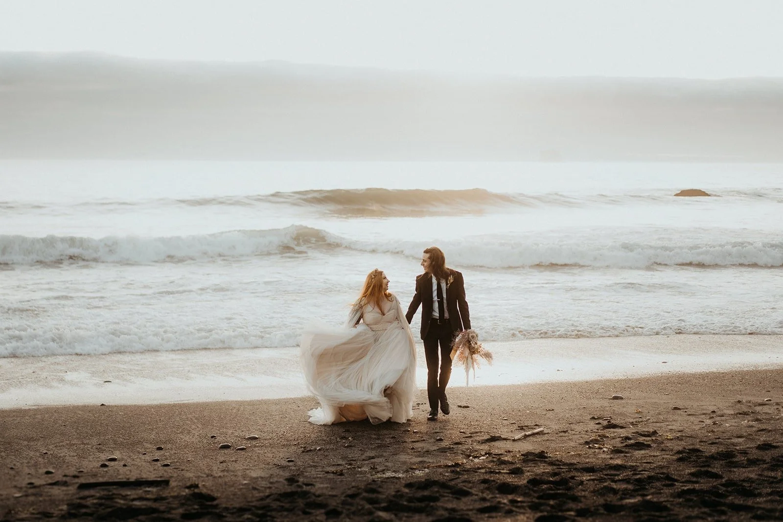 Bride and groom sunset portraits at Rialto Beach