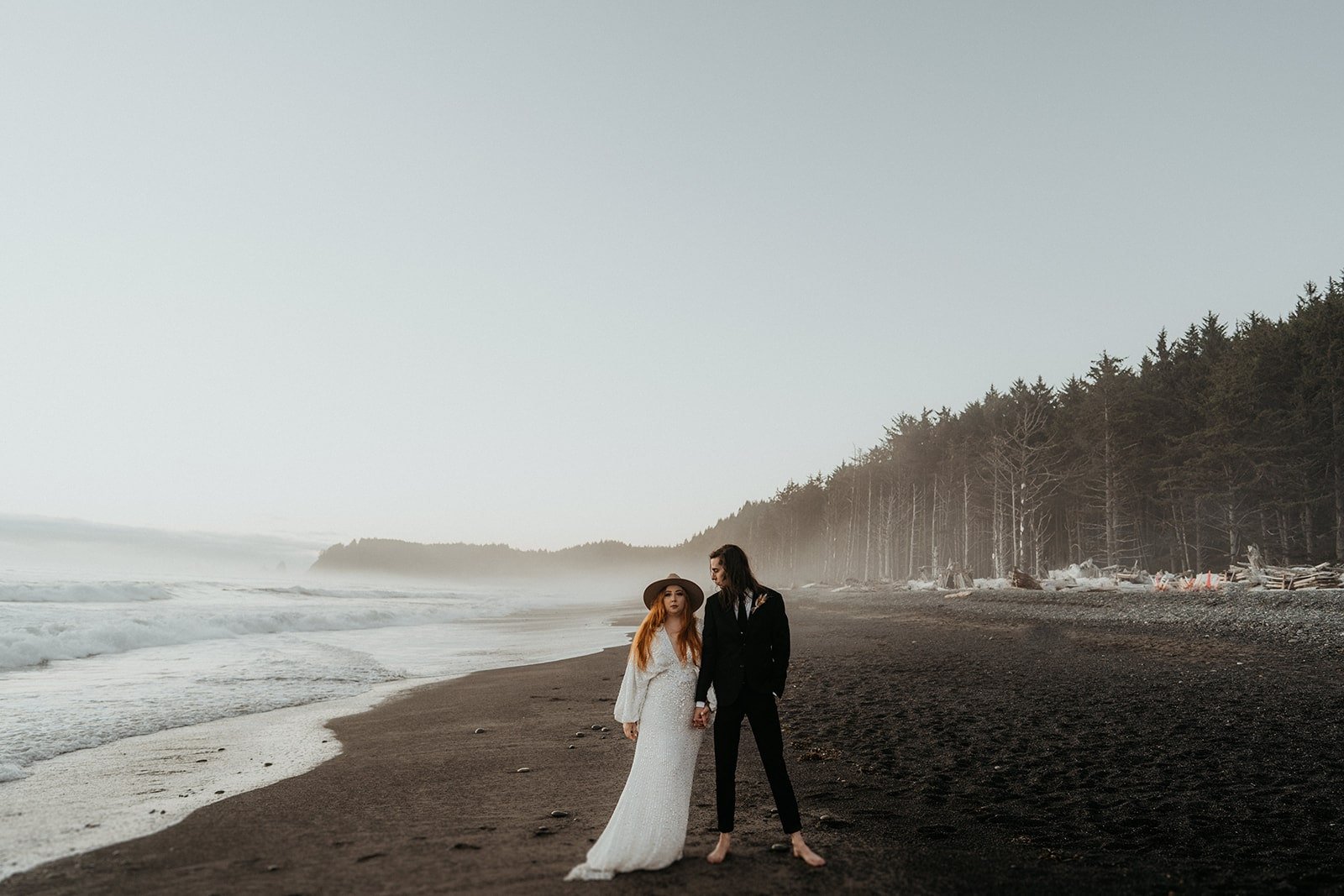 Bride and groom sunset portraits on the beach in Olympic National Park