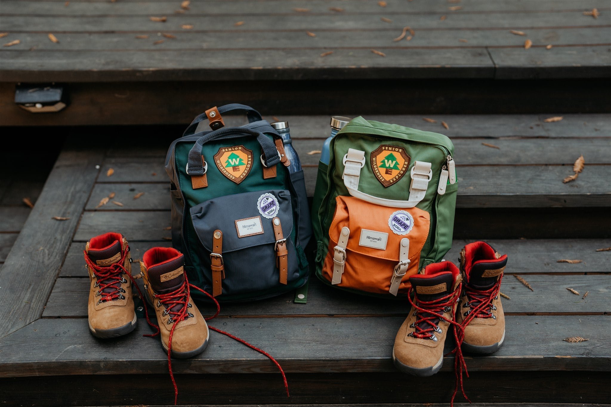Blue and green hiking backpacks with matching hiking boots