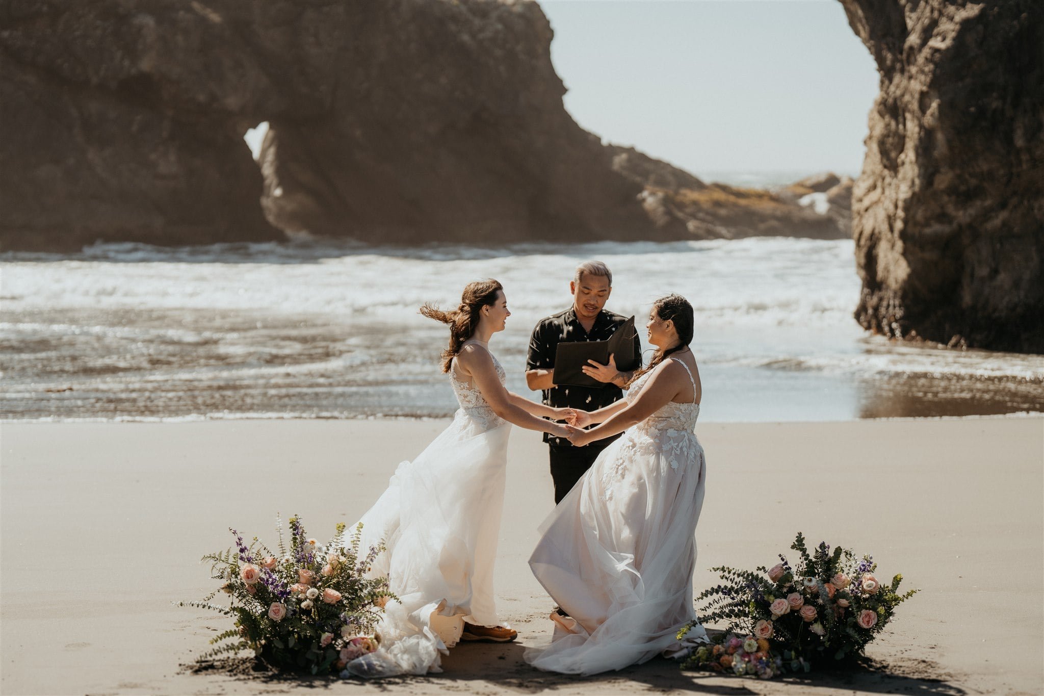 Windy elopement ceremony on the beach on the Oregon Coast