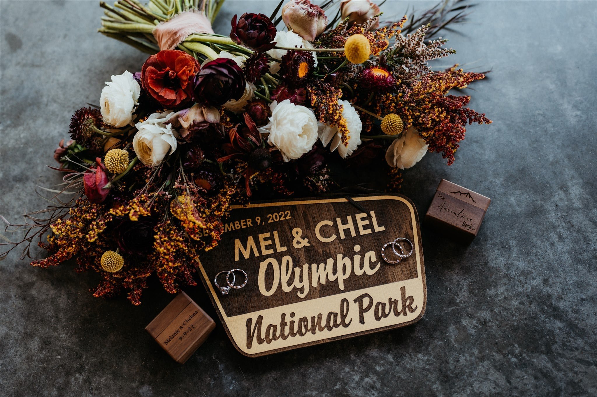 National park elopement sign with fall wedding flowers