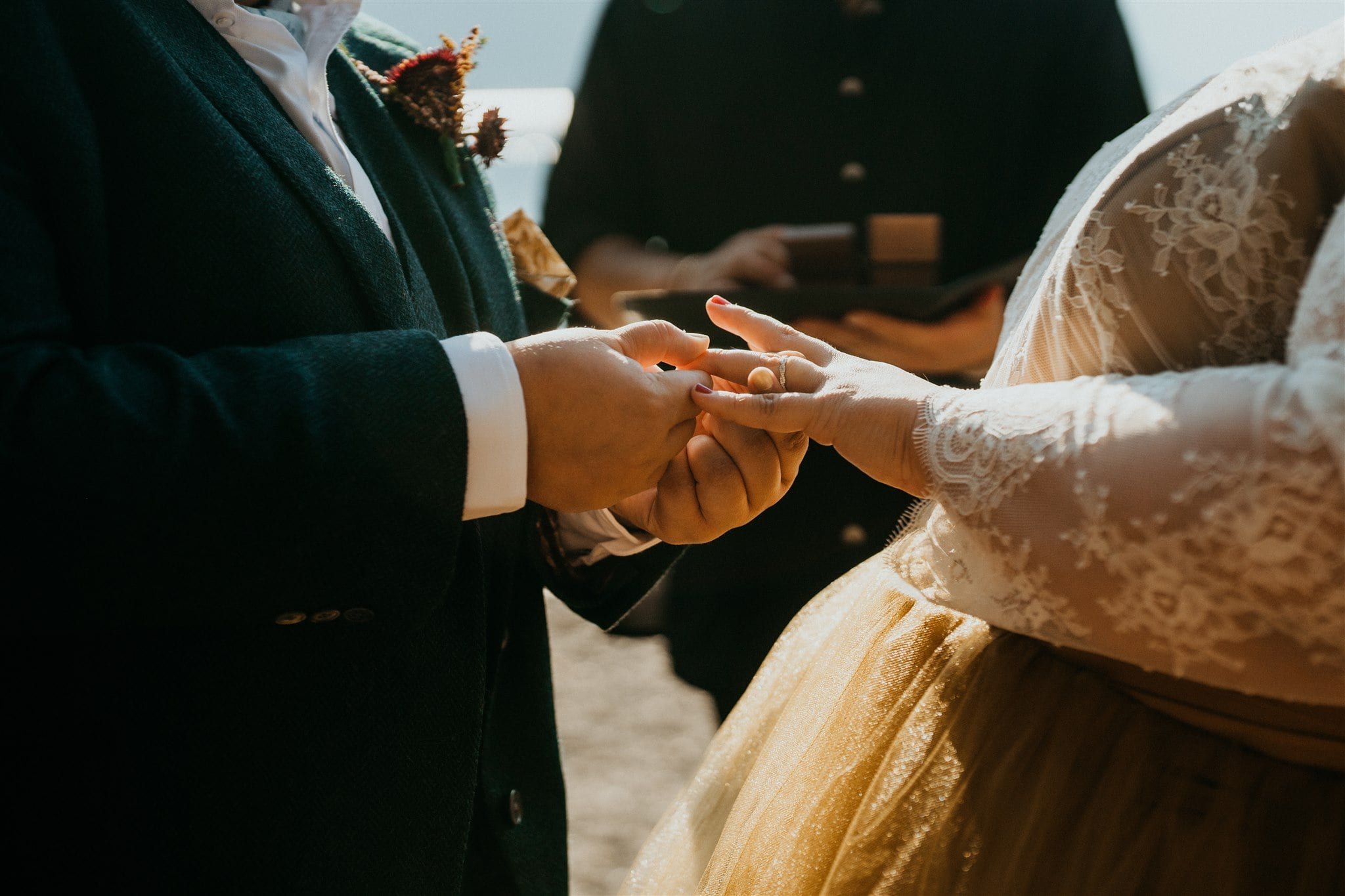 Brides exchange rings at Lake Crescent elopement
