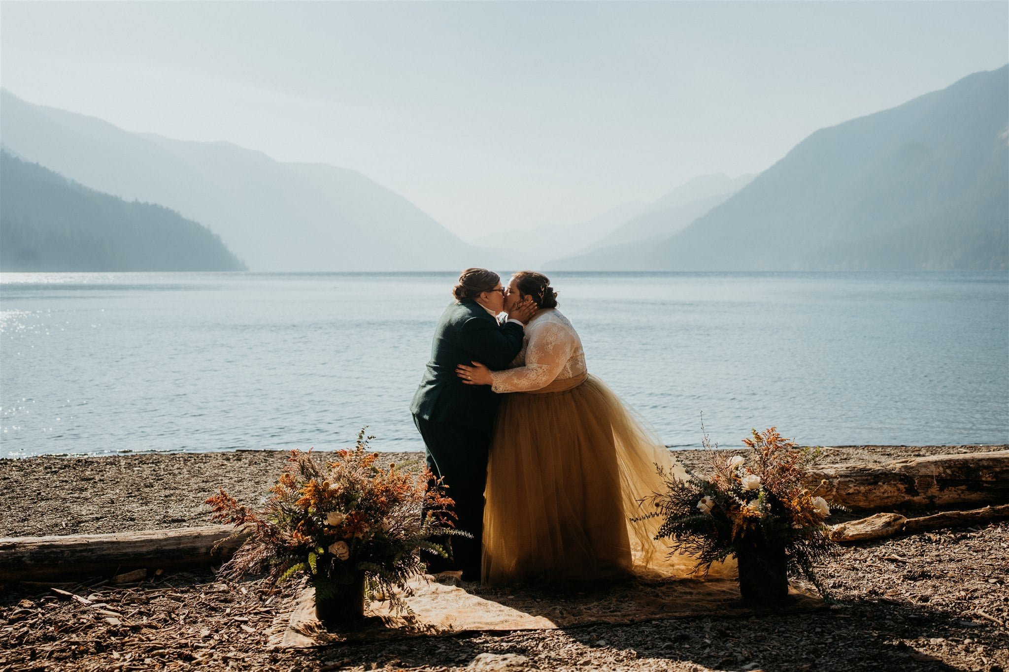 Brides kiss at Lake Crescent elopement