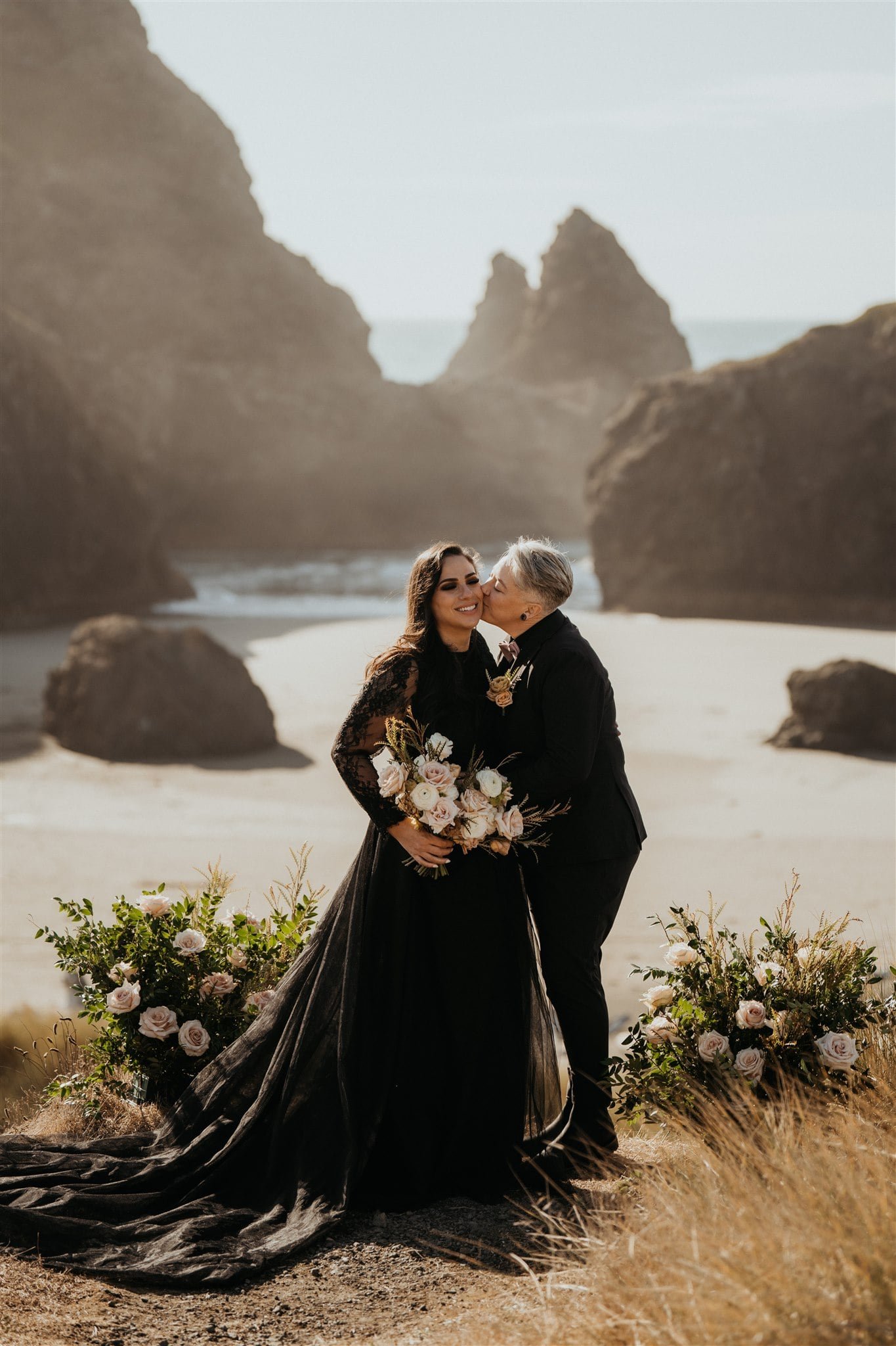 Brides kiss after elopement ceremony on the Oregon Coast