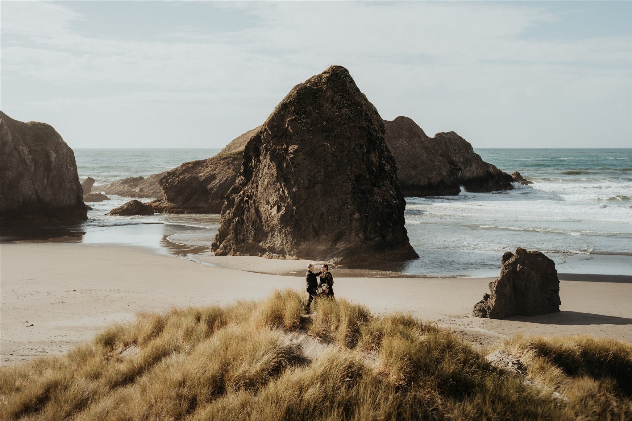 Pacific Northwest elopement portraits with two brides wearing all black wedding attire