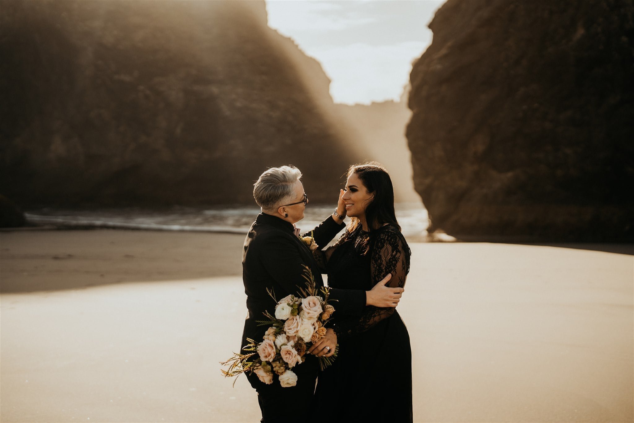 Pacific Northwest elopement portraits with two brides wearing all black wedding attire