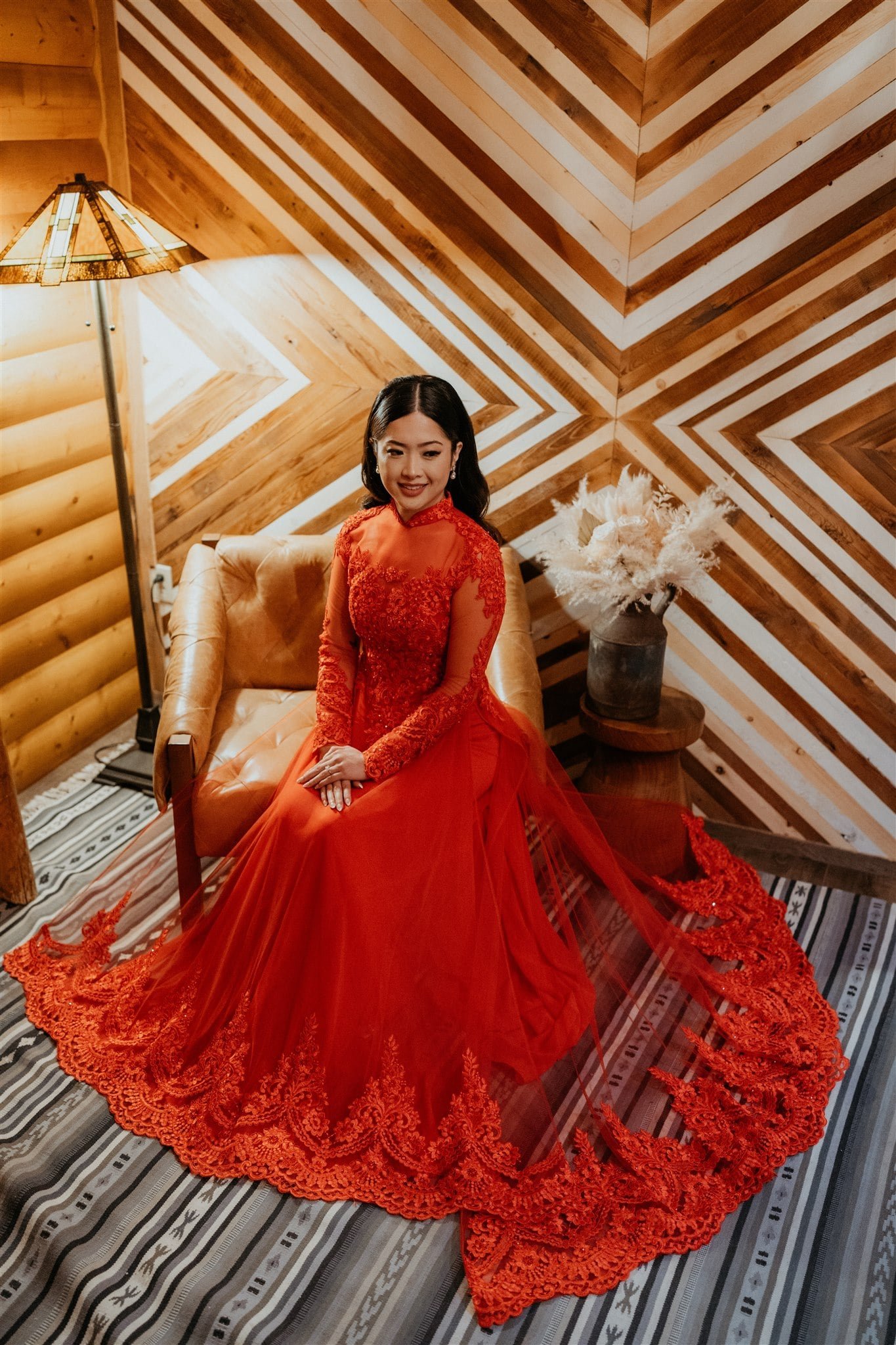 Bride wearing red Ao Dai for Vietnamese intimate wedding in Banff