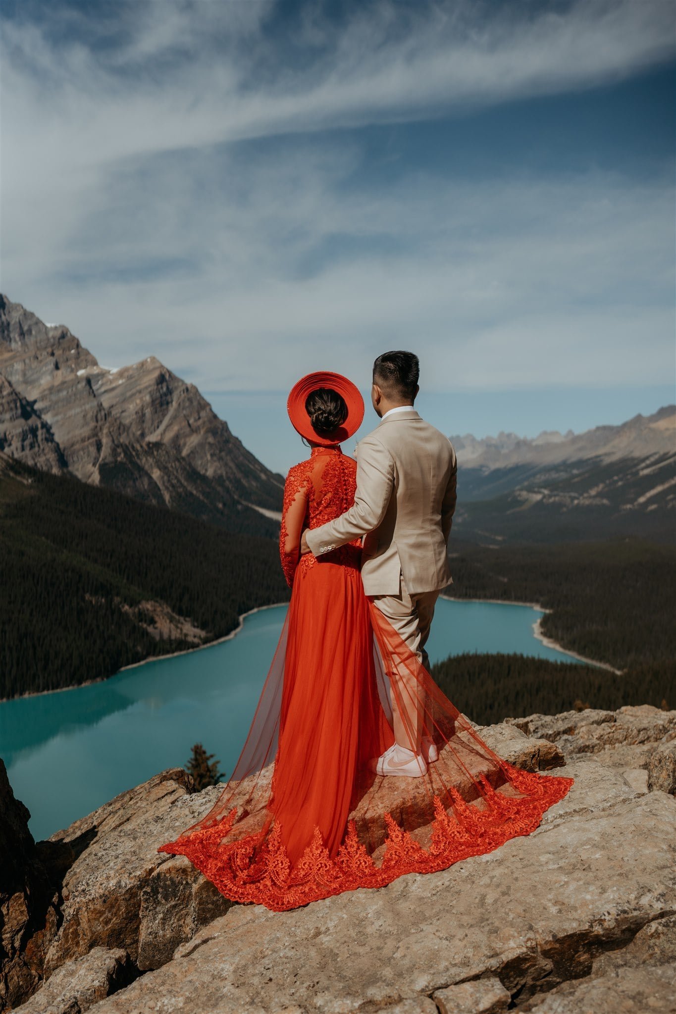 Bride wearing Ao Dai Vietnamese wedding attire during her elopement in Banff National Park