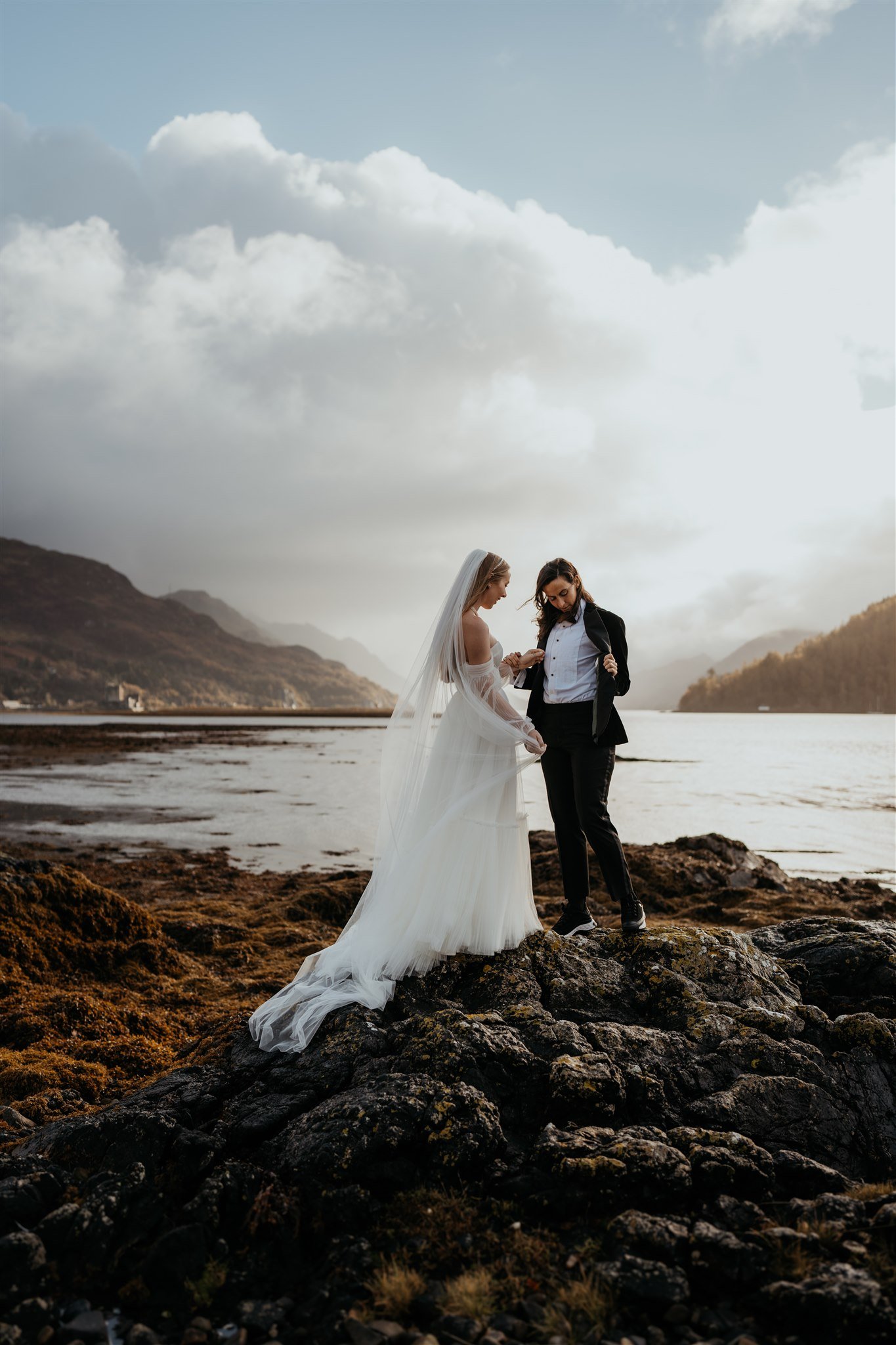 Brides admire elopement attire details after first look on the Isle of Skye