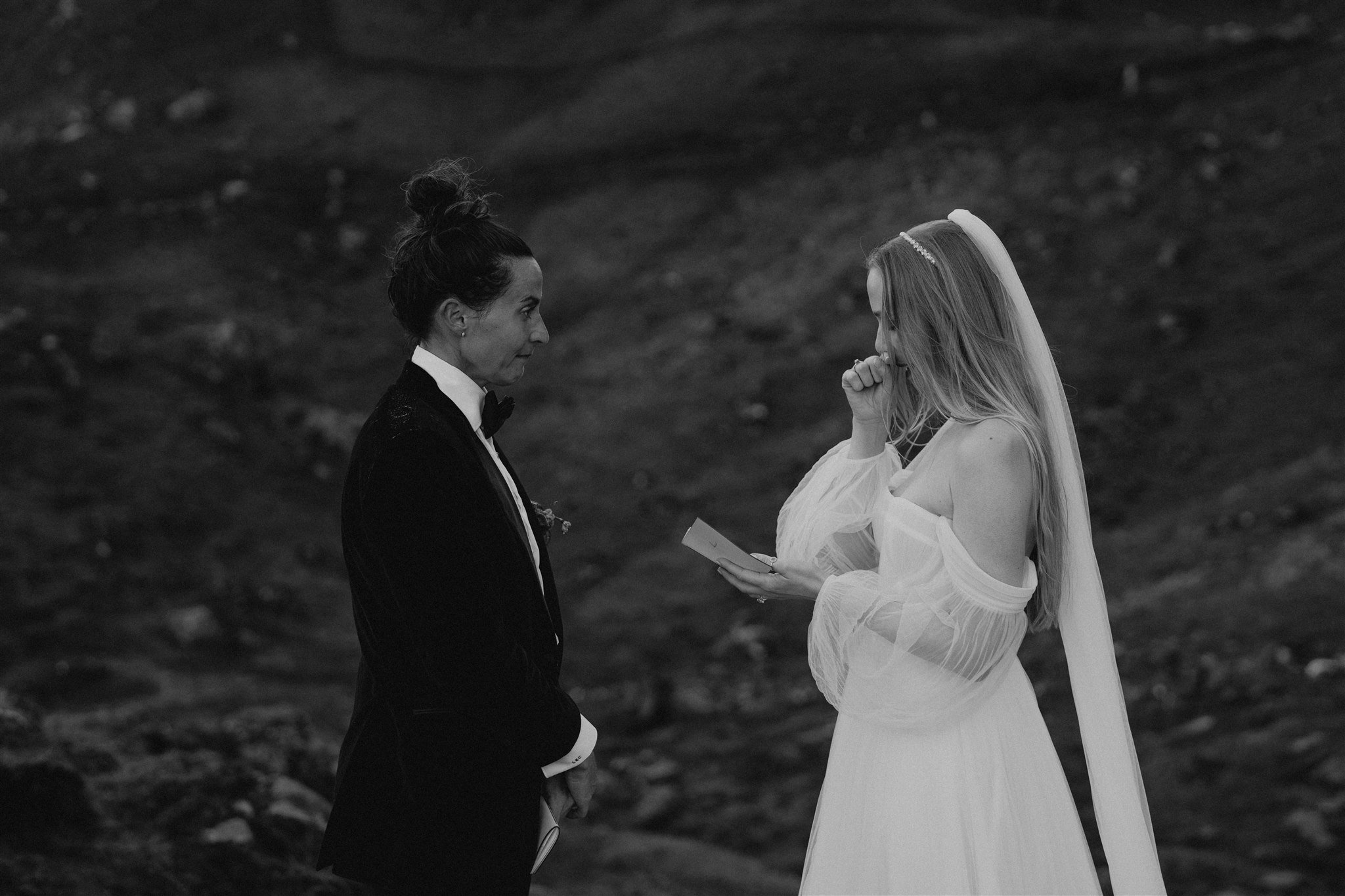 Bride gets emotional while reading personal vows at elopement on the Isle of Skye