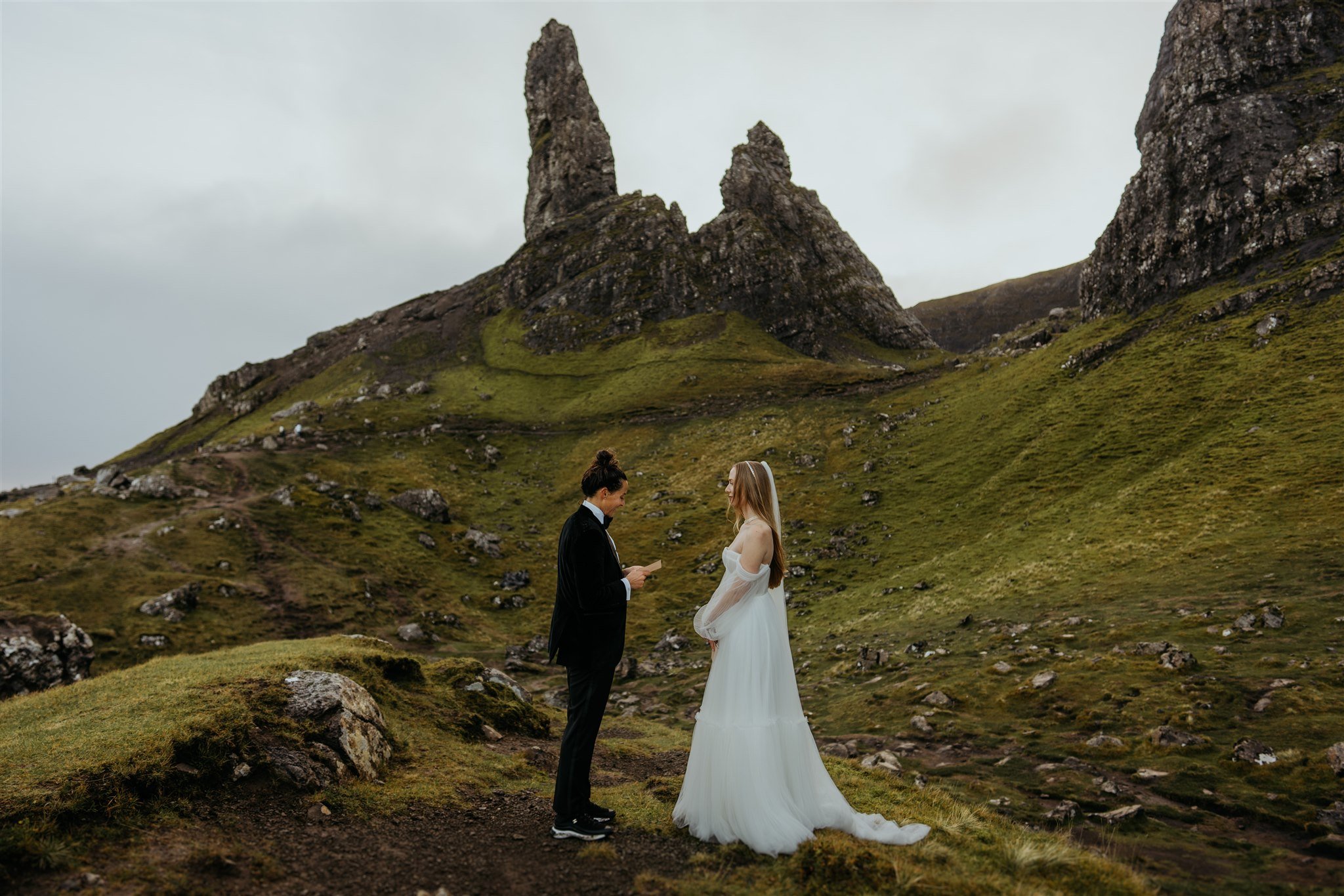 Brides read personal elopement vows while eloping on the Isle of Skye