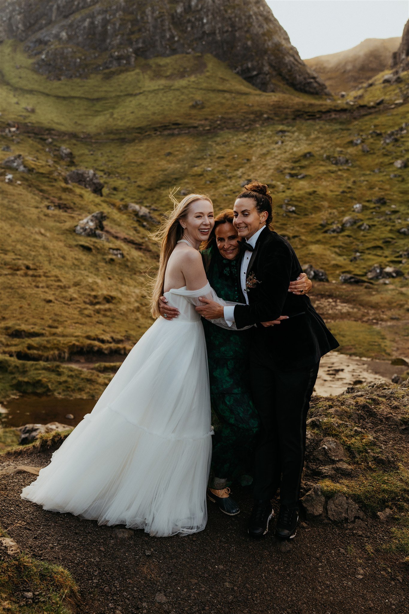 Brides hug their mother after their Isle of Skye elopement