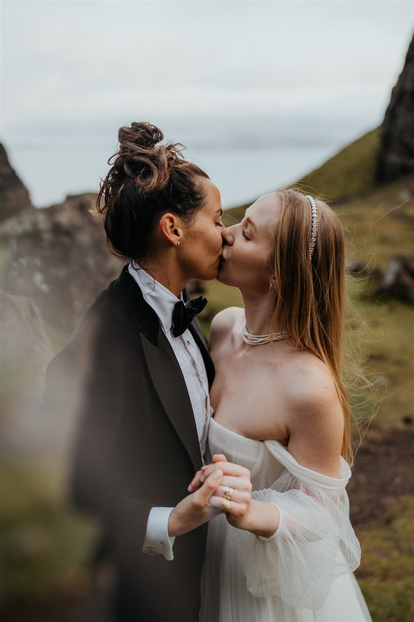 Brides kiss during their adventure elopement photos on the Isle of Skye Scotland