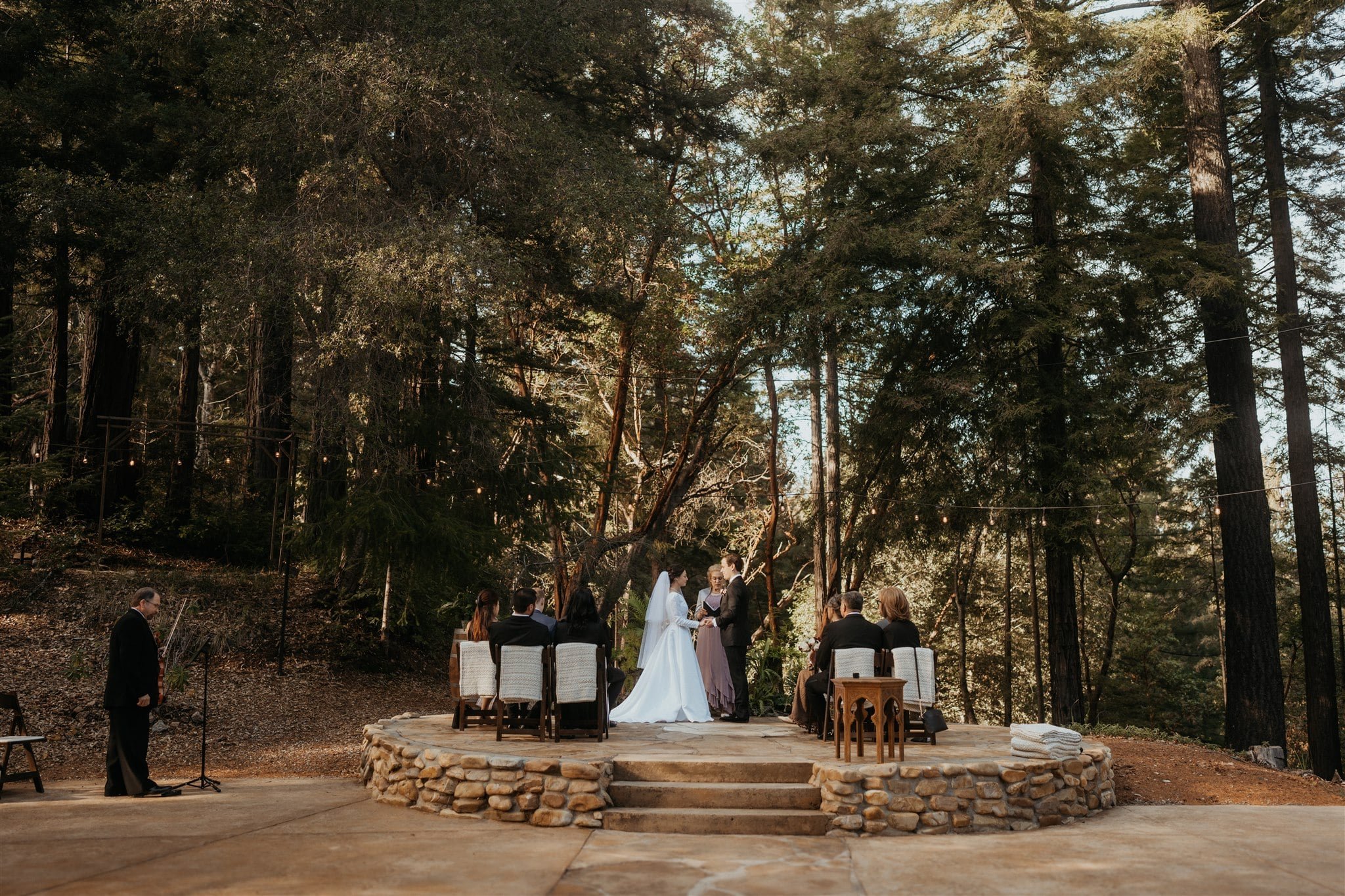 Bride and groom standing at the wedding altar at their California micro wedding at Sequoia Retreat Center