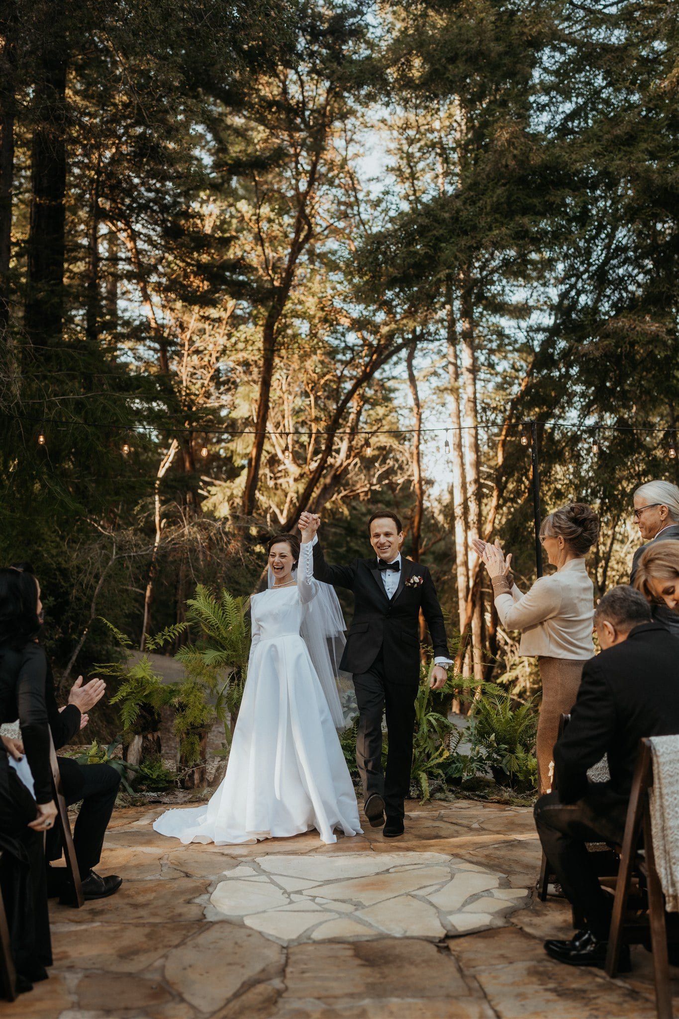 Bride and groom cheer as they exit their California micro wedding ceremony