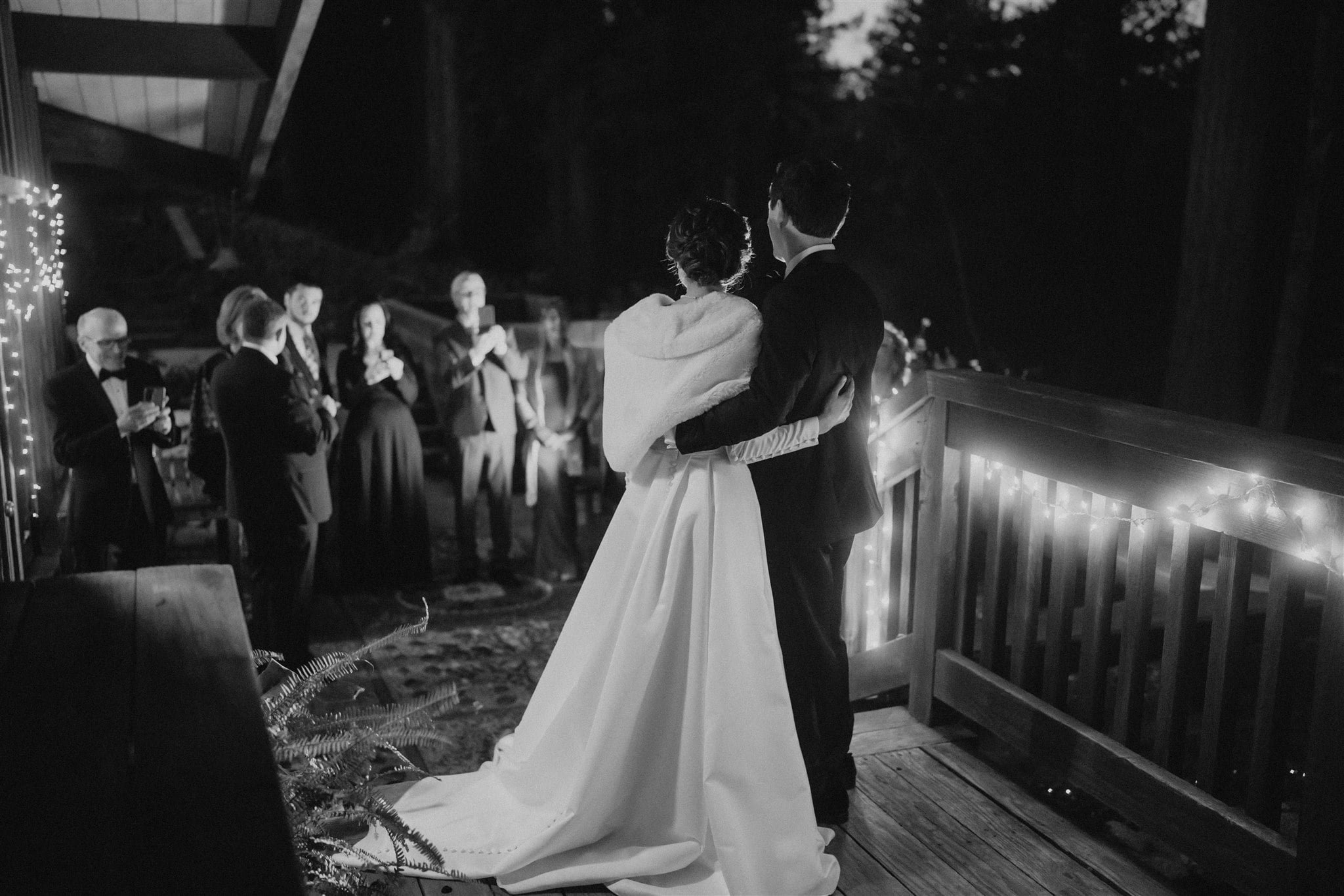 Bride and groom enter winter wedding reception at Sequoia Retreat Center