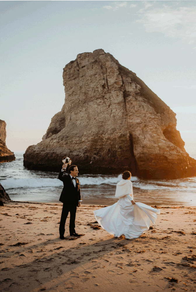 Couple dances on the beach at sunset after their California micro wedding ceremony