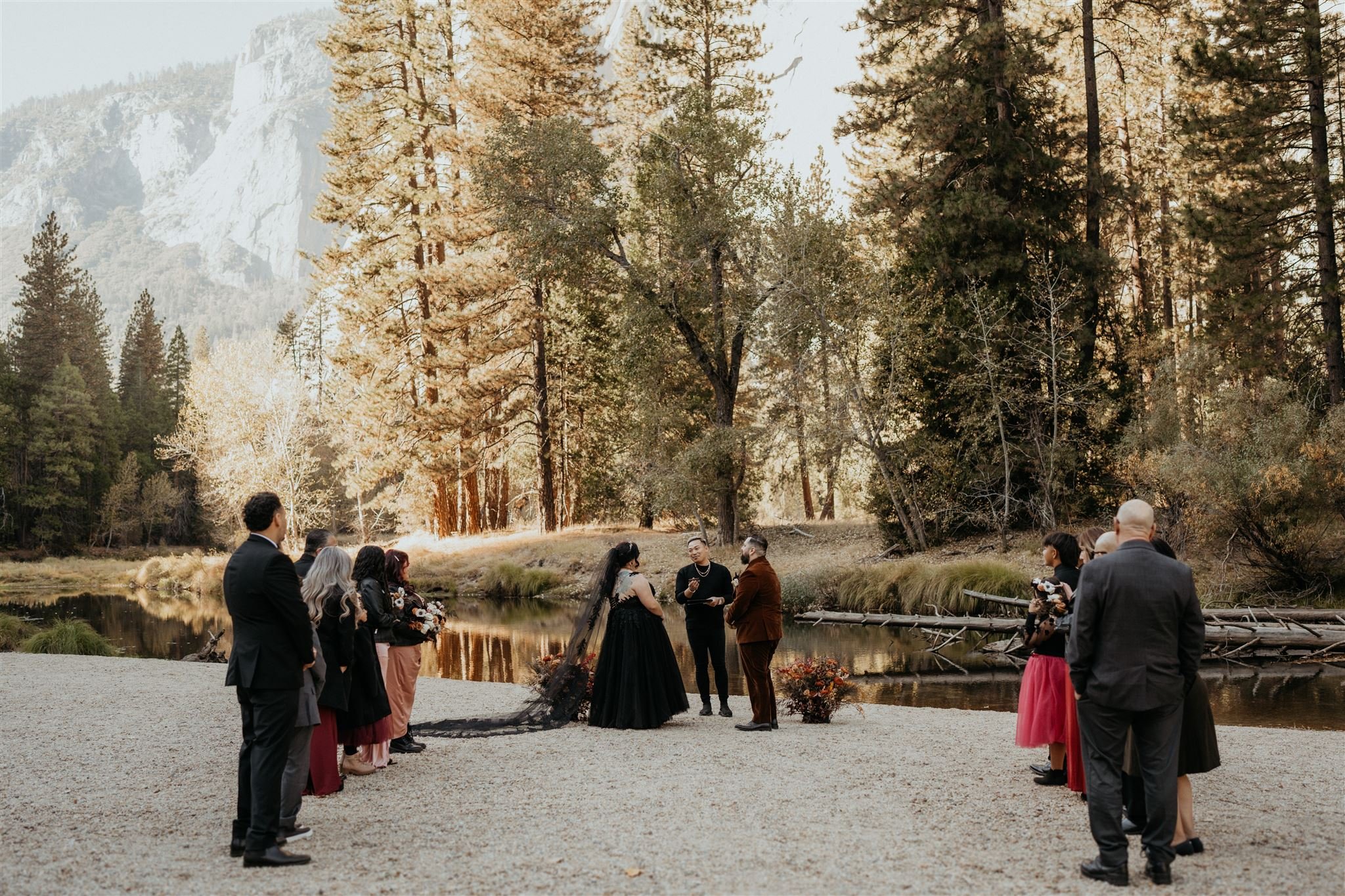 Bride and groom exchange vows at their Yosemite elopement with family and friends