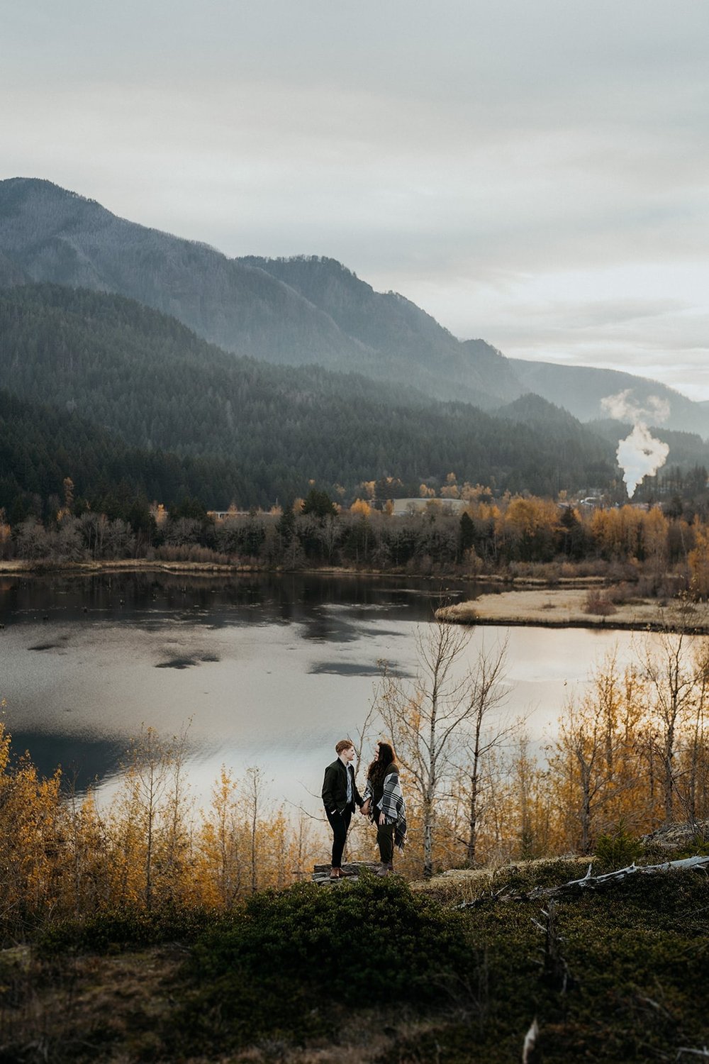 Couple stands by the edge of the water during their photo session at the Columbia River Gorge