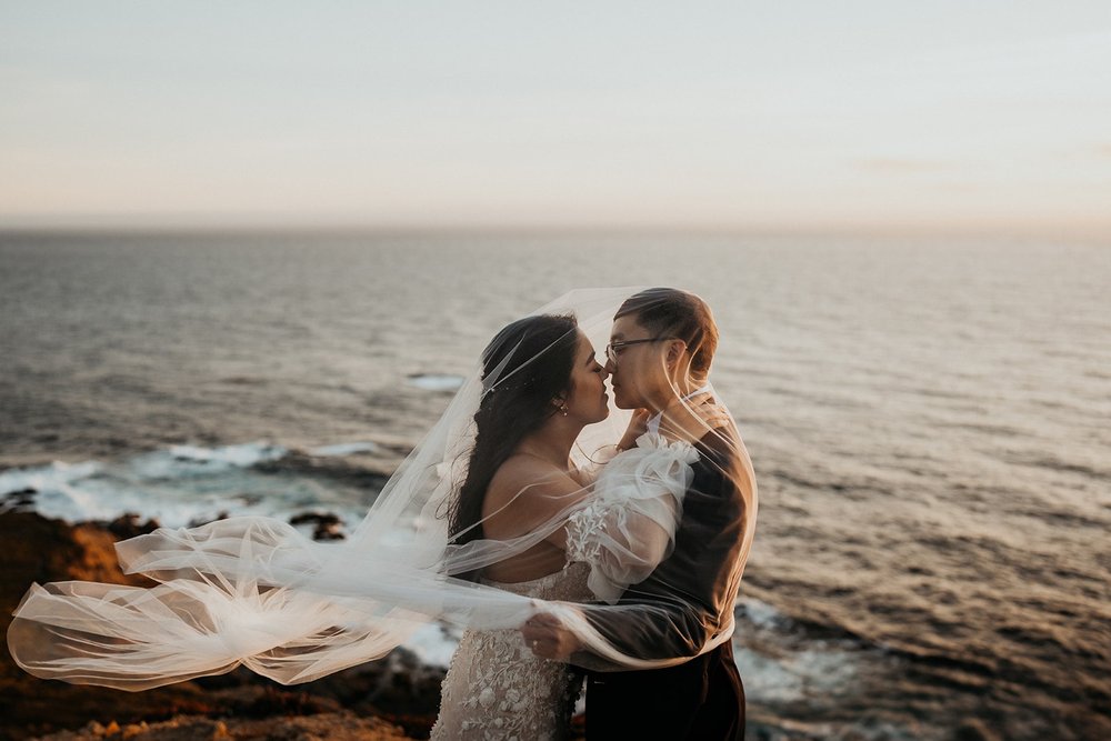 Bride and groom kiss during their sunset elopement photos at Big Sur