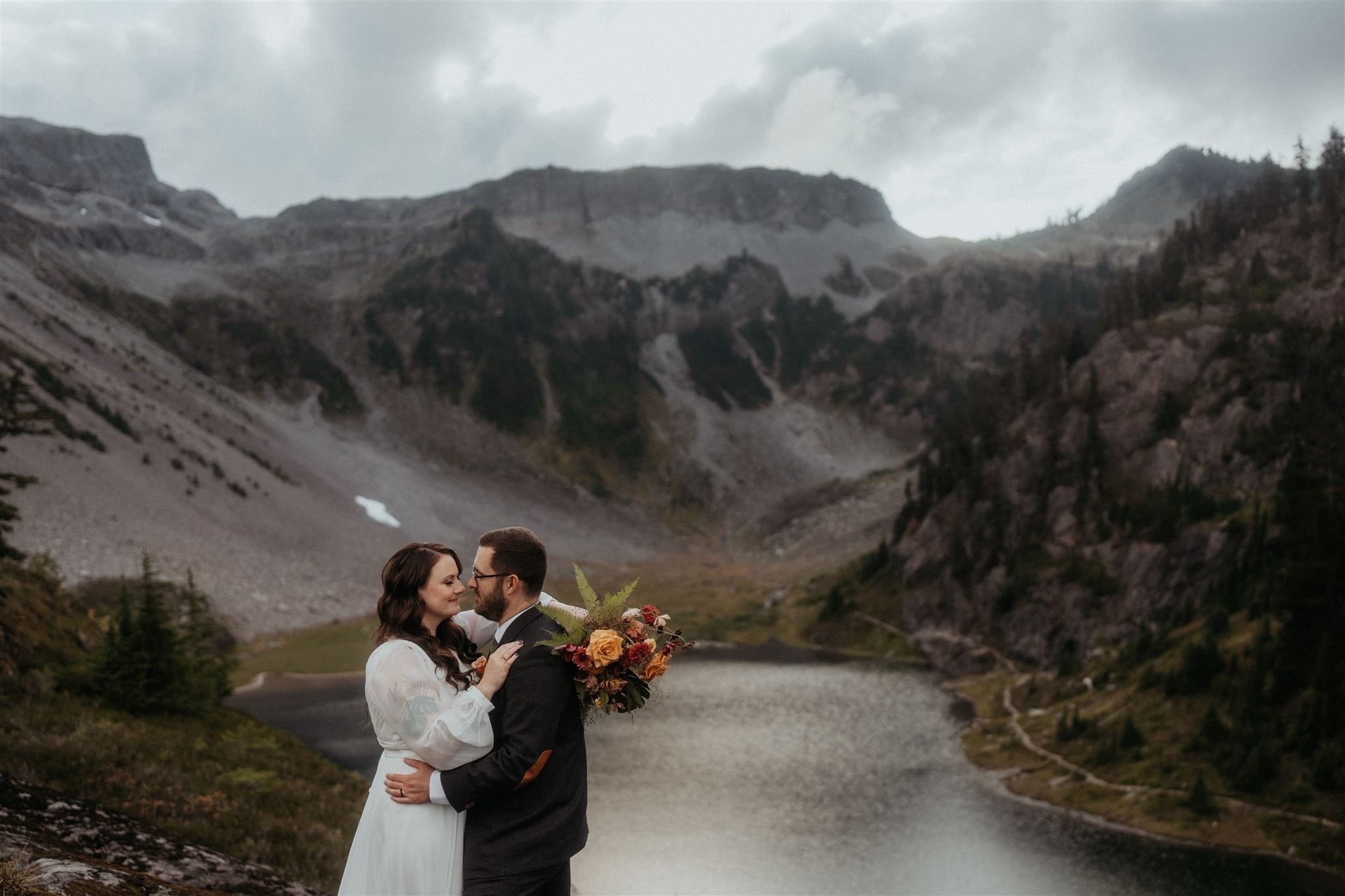 Bride and groom dance in the mountains at their North Cascades elopement