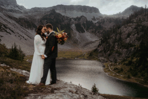 Bride and groom hold hands while dancing at their North Cascades elopement