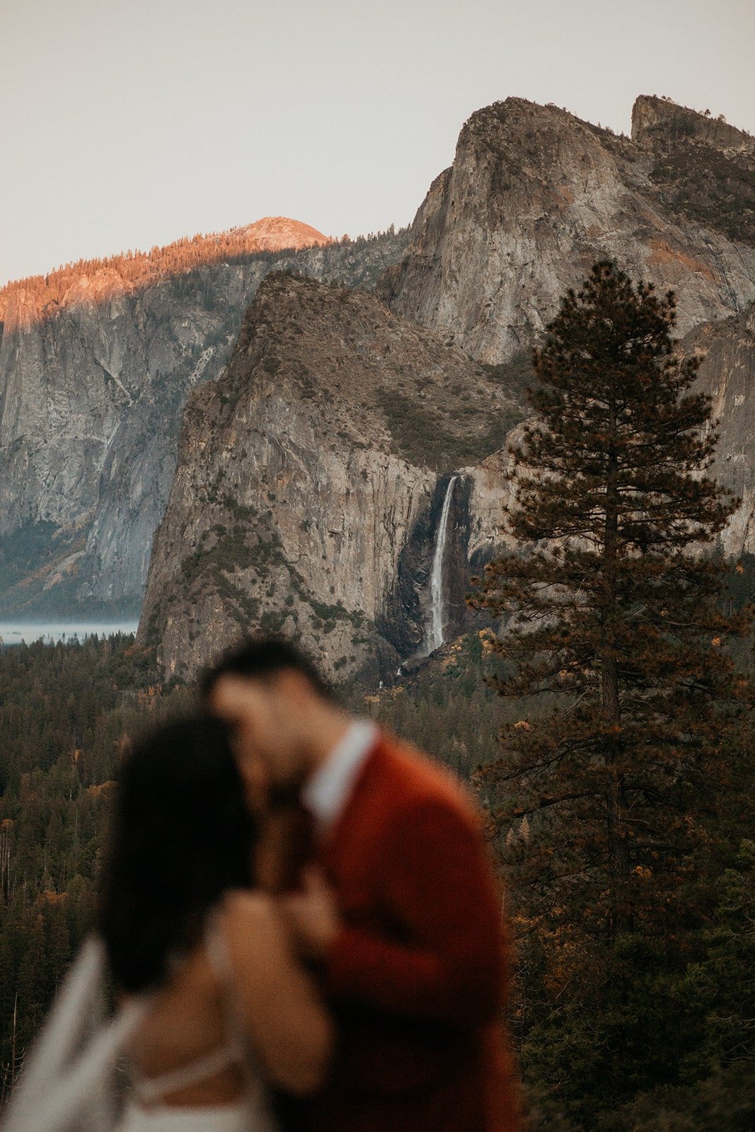 Bride and groom kiss at Tunnel View elopement at Yosemite National Park