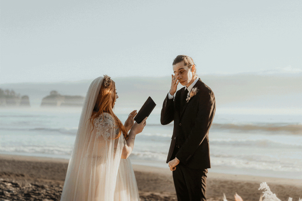 Groom wipes during during vow exchange at Rialto Beach elopement