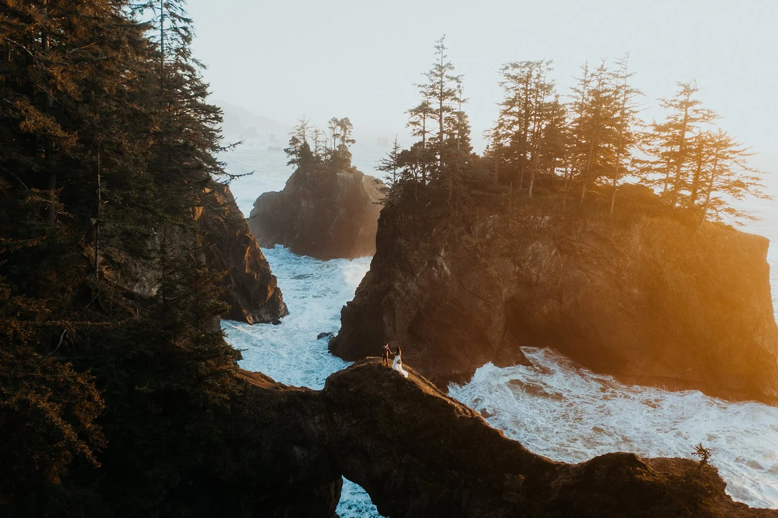 Two brides at Natural Bridges on the Oregon Coast