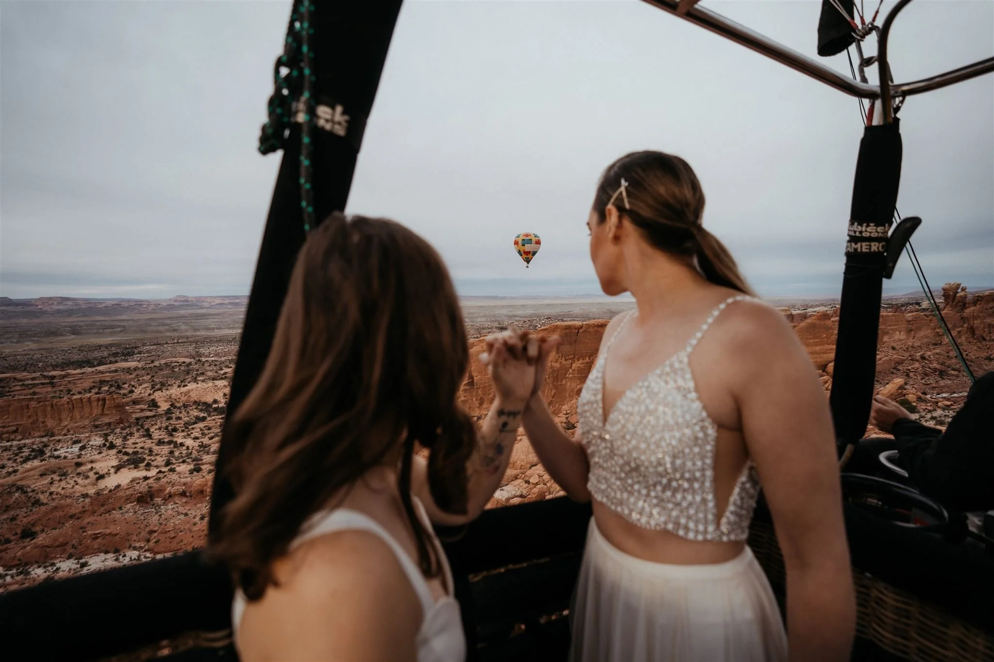 Two brides in a hot air balloon for their Utah elopement