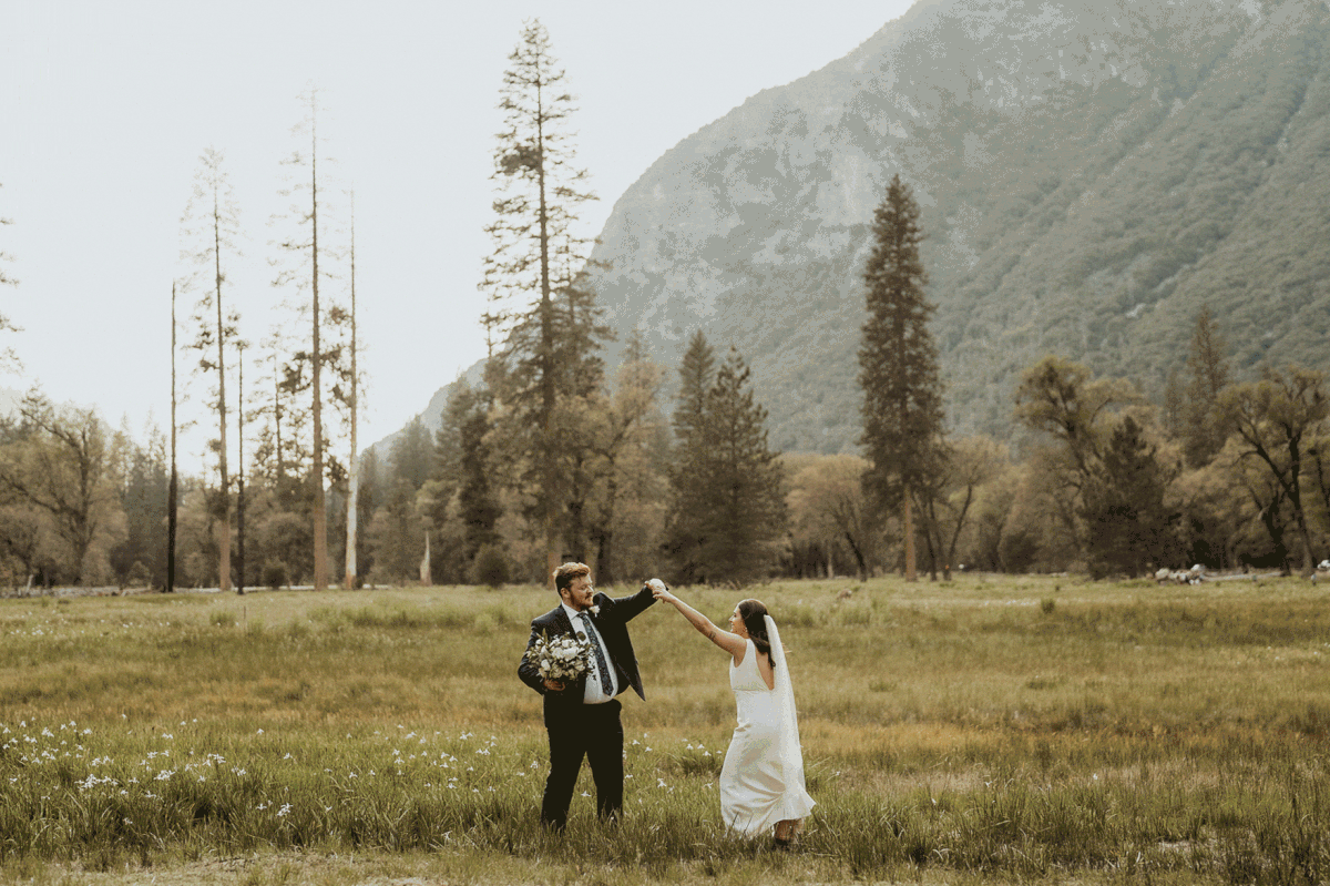 Bride and groom dancing in the mead during their Yosemite elopement