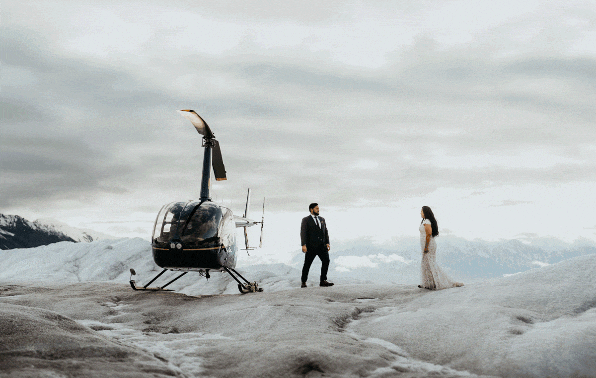 Bride and groom walking towards each other during their Alaska helicopter elopement