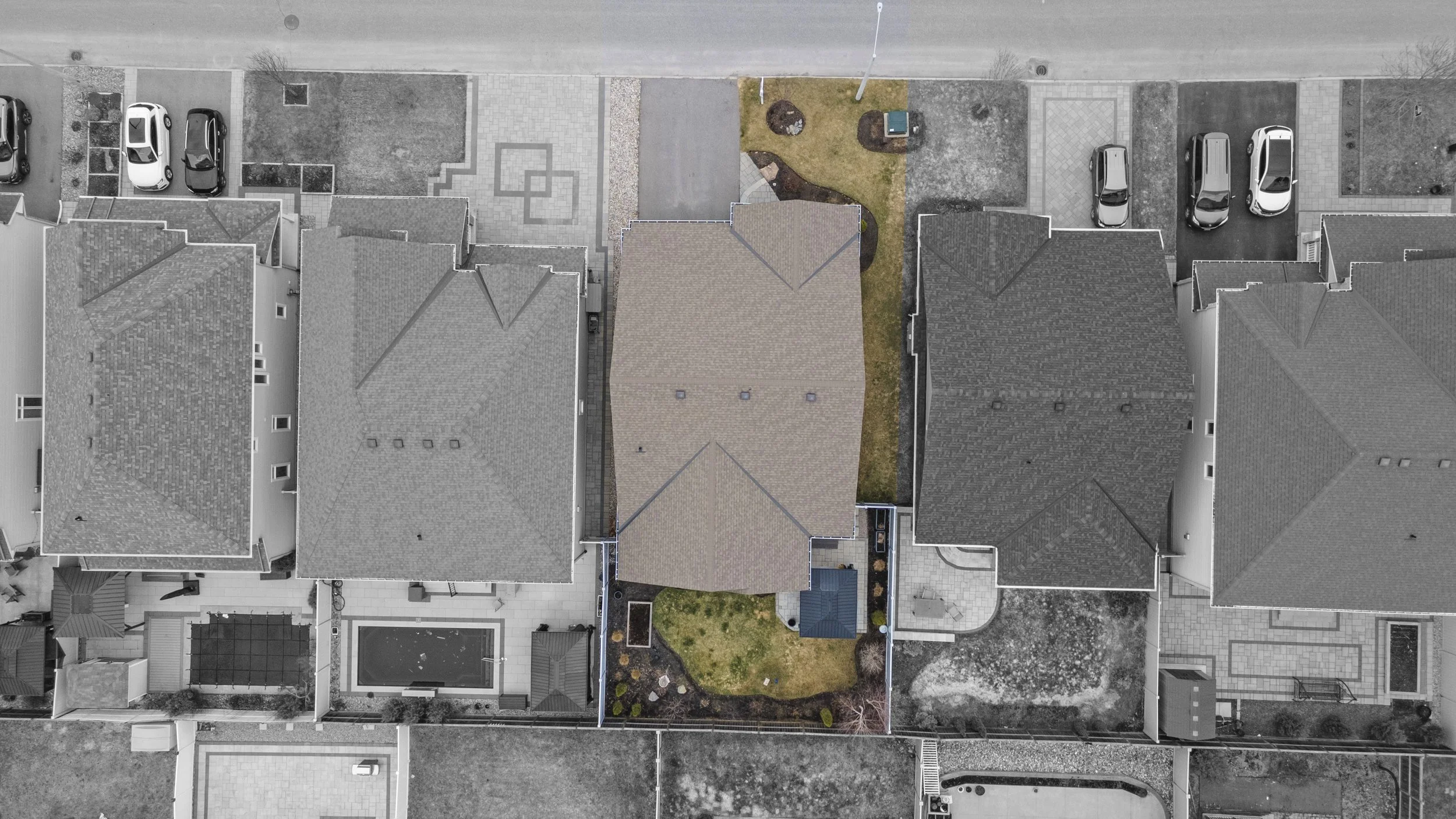 Top-down aerial drone photograph showing a property, lot and neighbouring homes