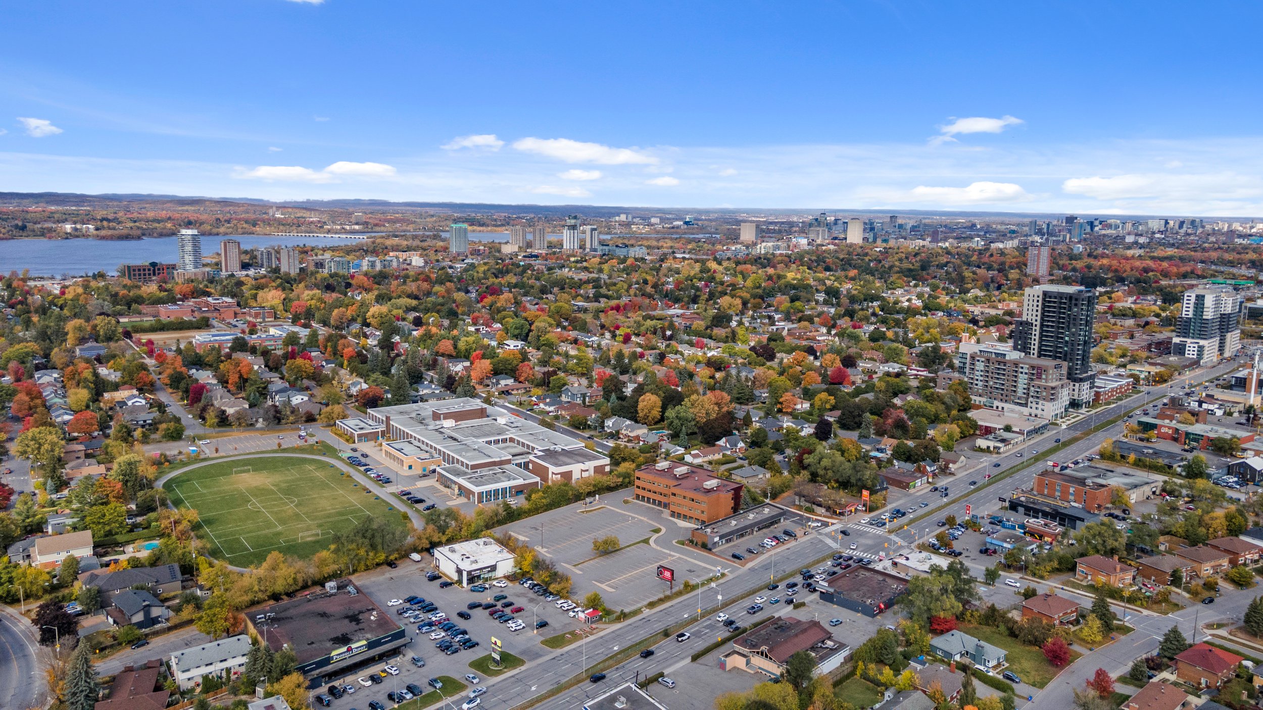 Professional aerial photography showing an Ottawa neighbourhood and surrounding landscape