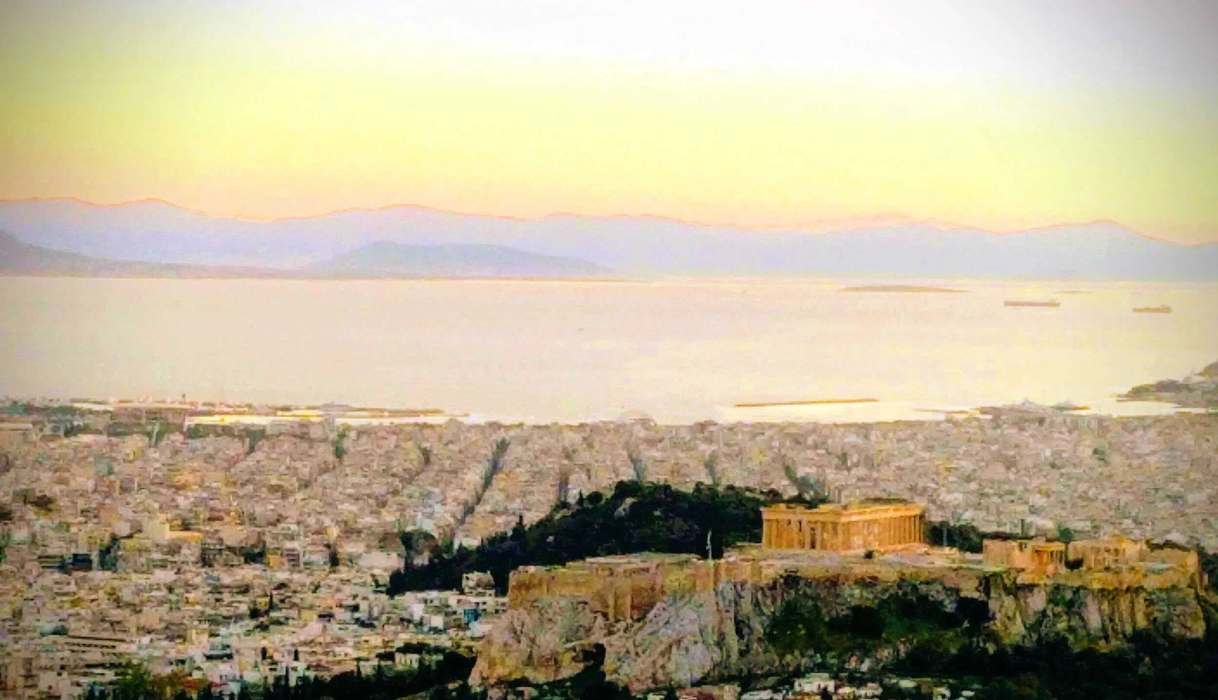Aerial view of the Acropolis of Athens with the Parthenon in sunset light.