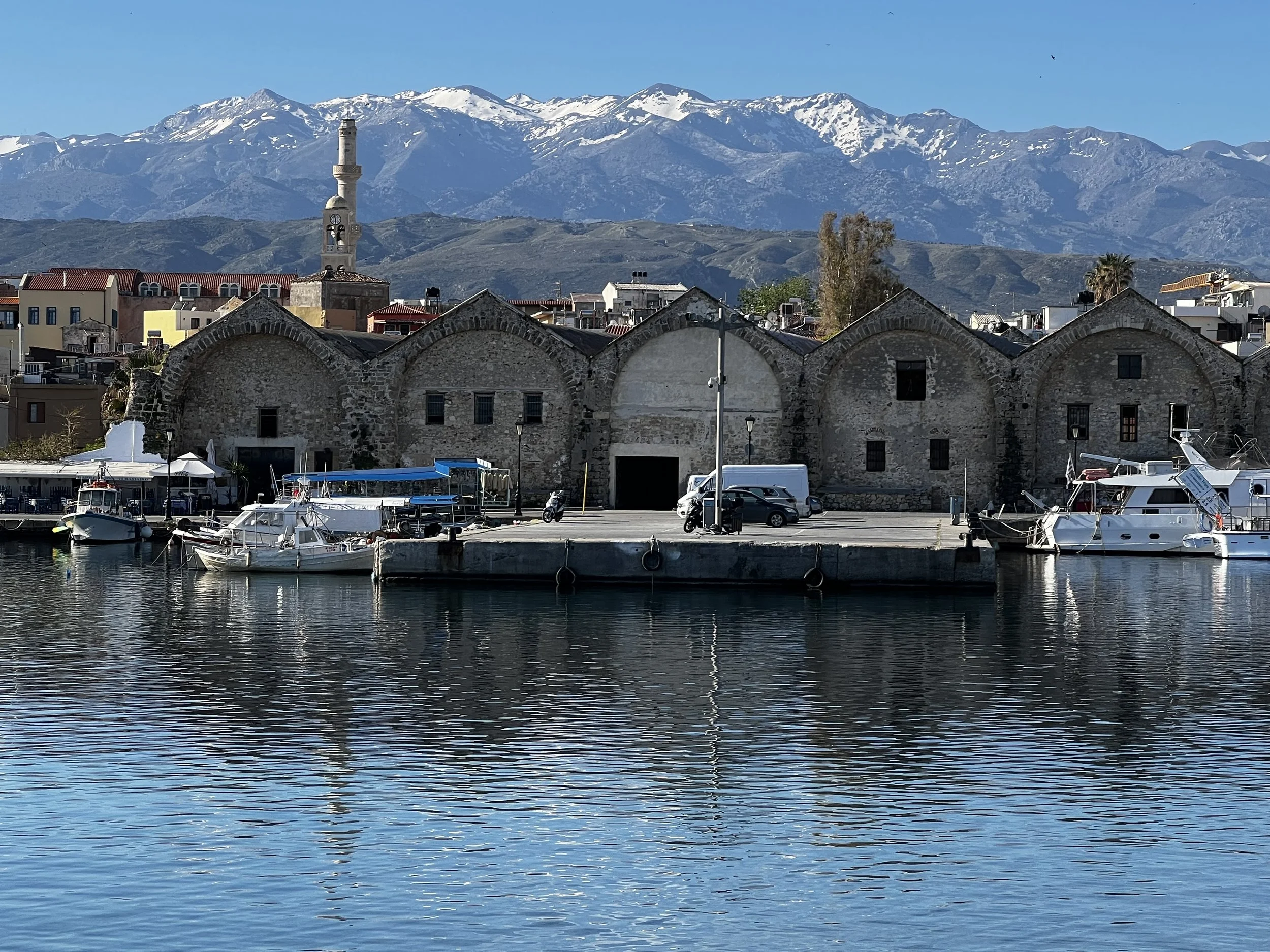 Harbor with boats and snowy mountains, iconic Chania photo
