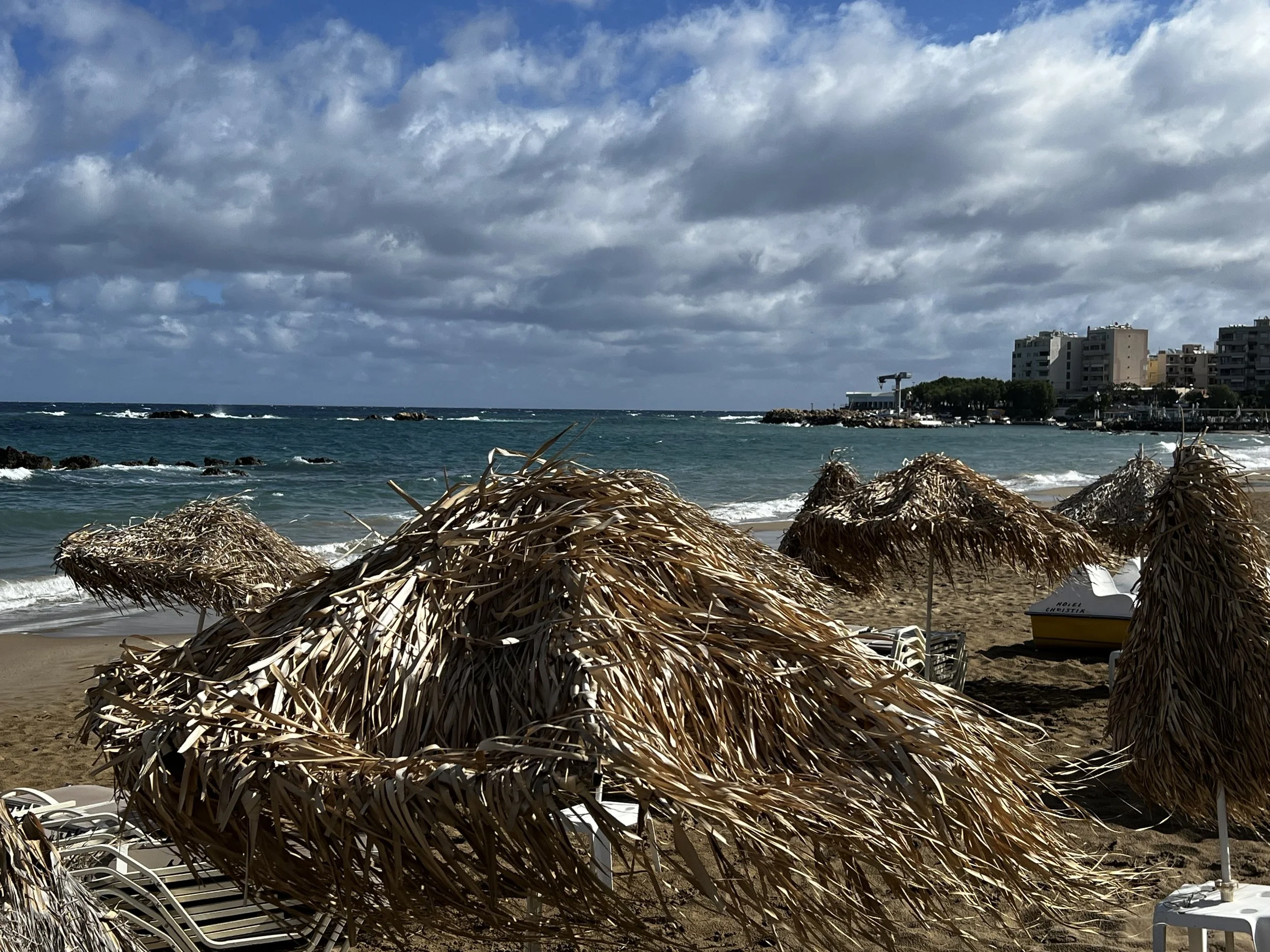 Southern Chania Beach with straw umbrellas