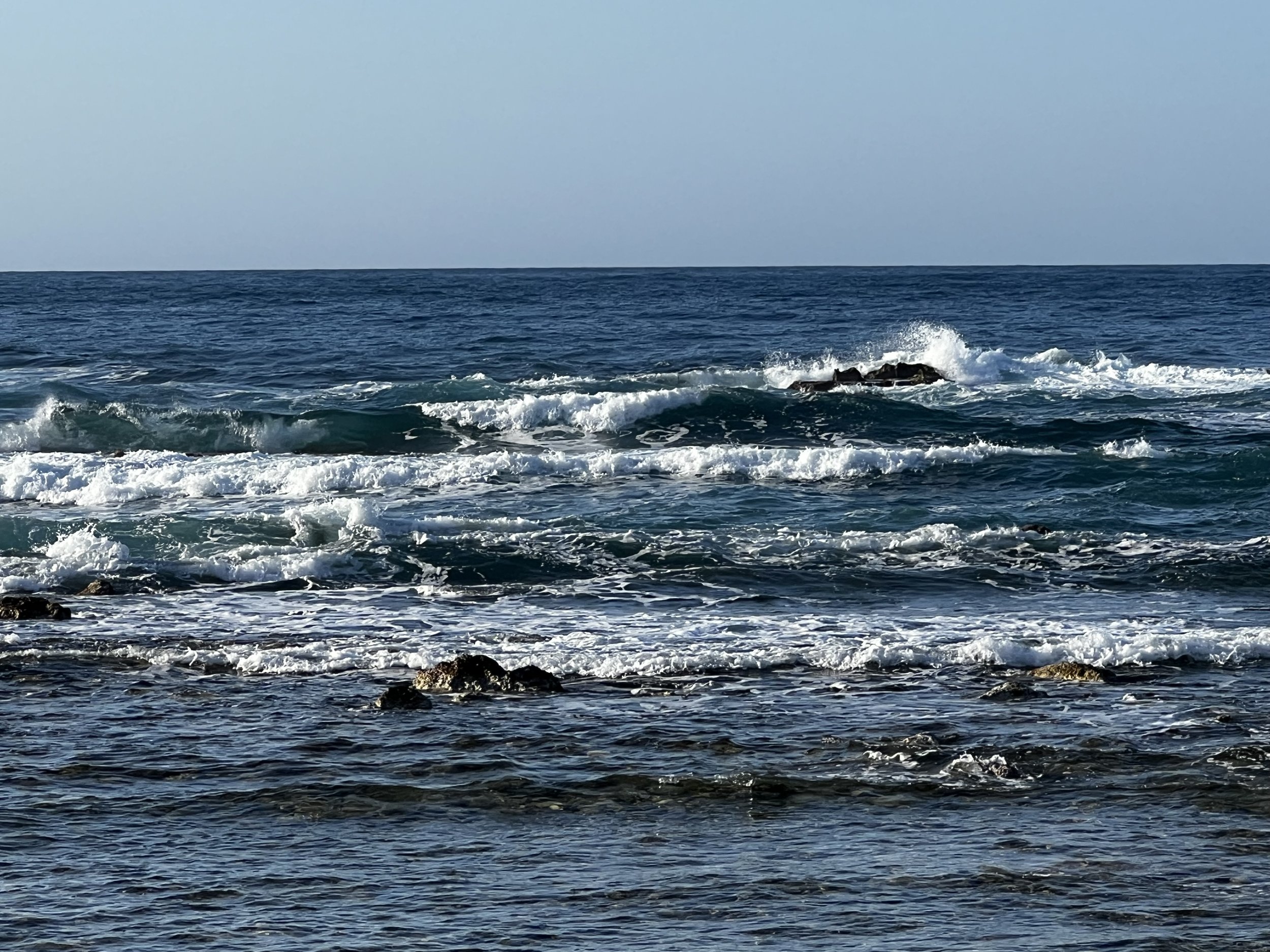 Waves crashing on a rocky shoreline