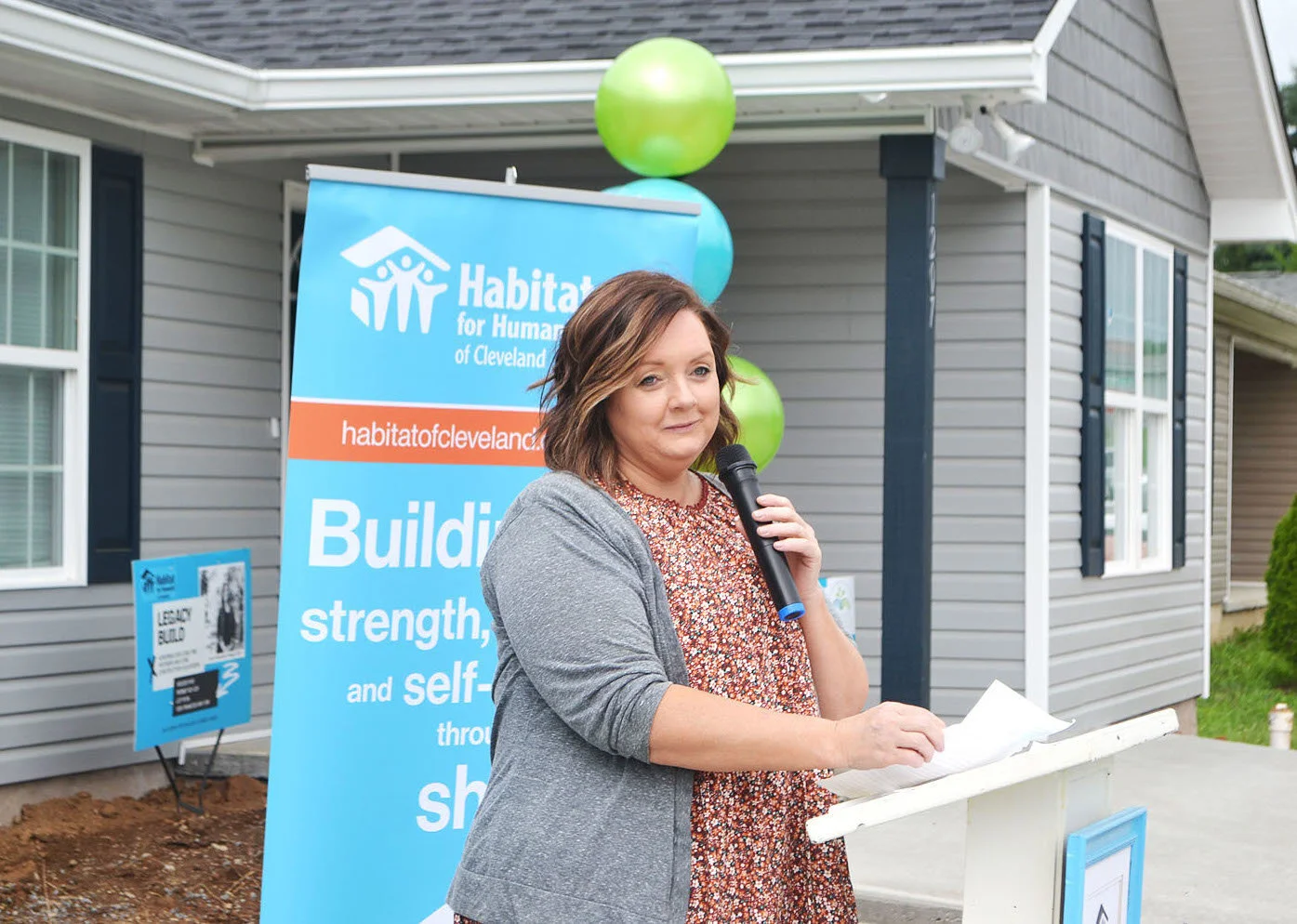 Habitat dedication brings two sets of homeowner smiles