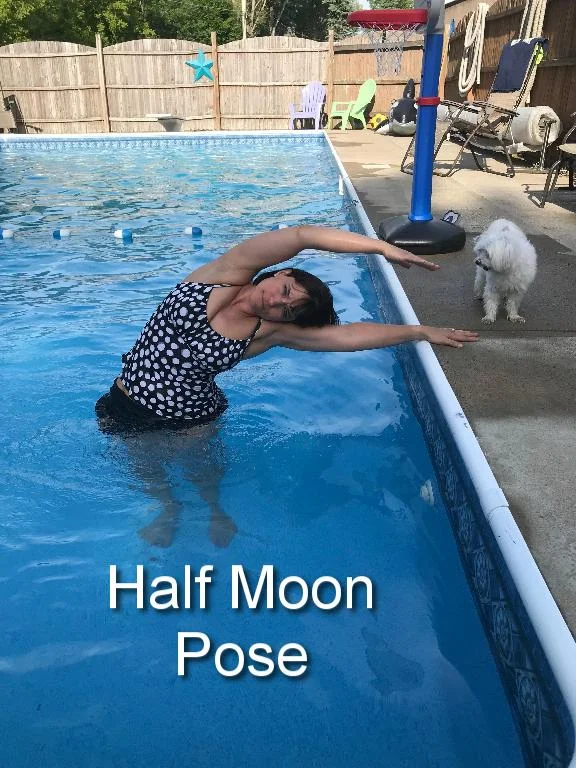 Keeping both feet planted on the ground, extend your torso into a side stretch toward the side of the pool. Hold on to the side of the pool to help with balance. Turn around and repeat with the other side. 
