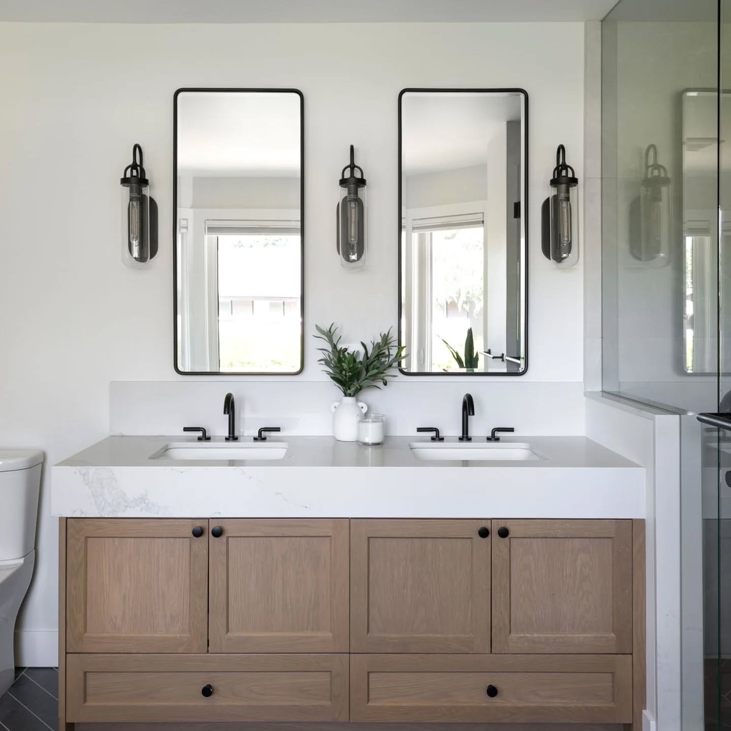 This North Vancouver home has been in the same family for years, and it was such a joy to help reimagine it for the next generation. ✨
� We completely rework
ed the ensuite layout to create better flow and function, layering in warm oak, matte black 