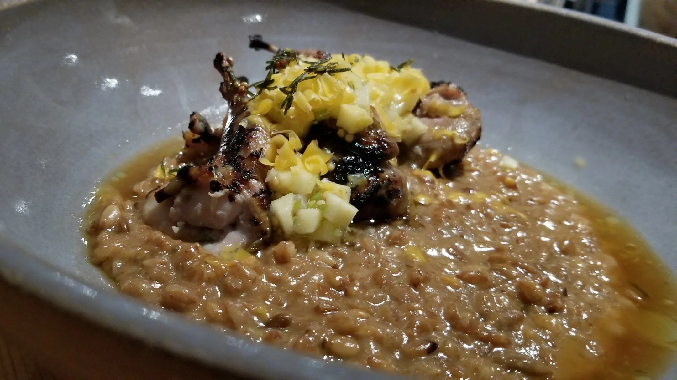 The apple bits added a nice touch to the charred quail. Photo by Nick Bailey