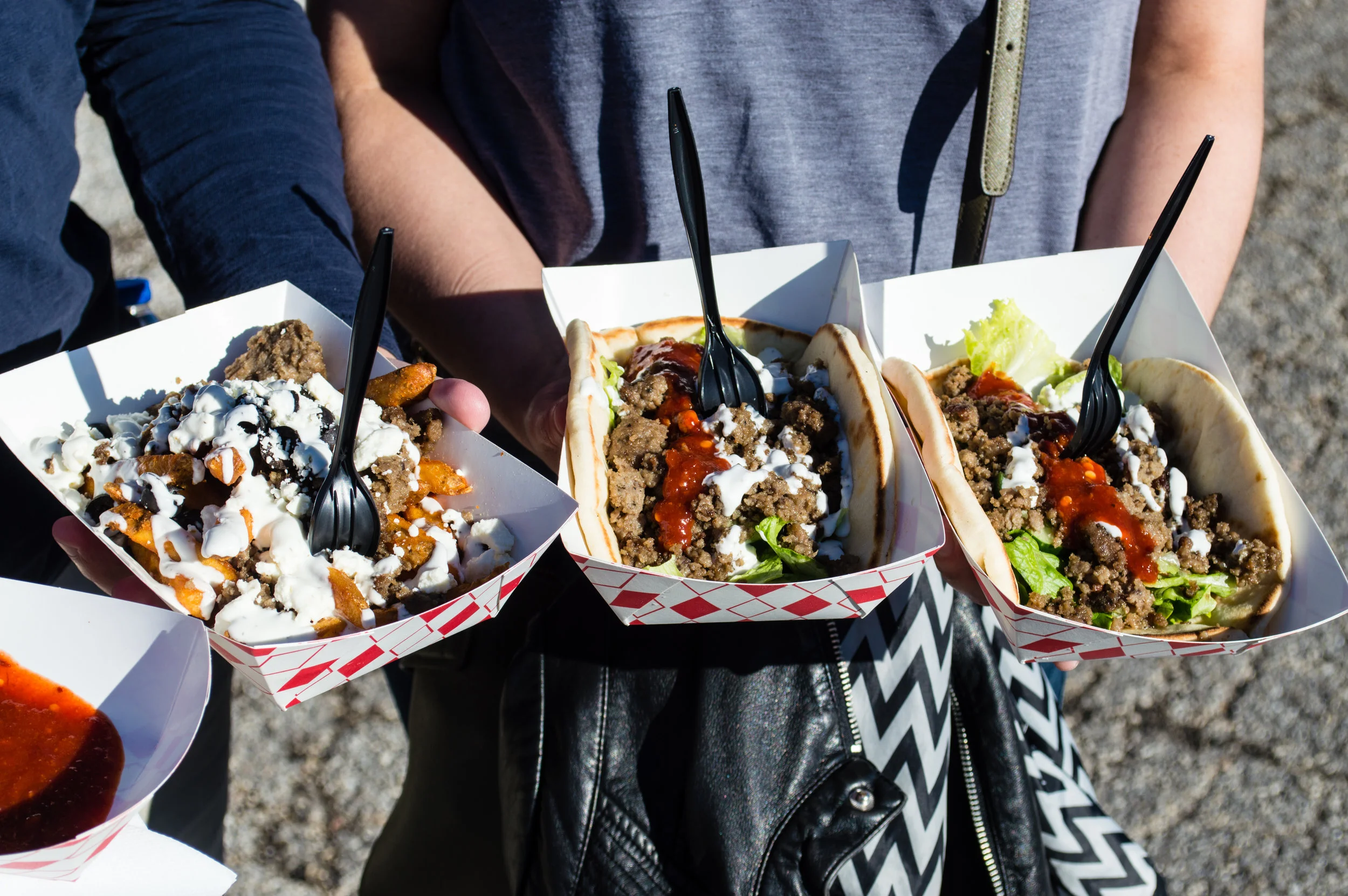 Fans of the food truck fest enjoyed the food — they just didn’t enjoy waiting upwards of 20 minutes waiting for it. Photo by Nick Bailey