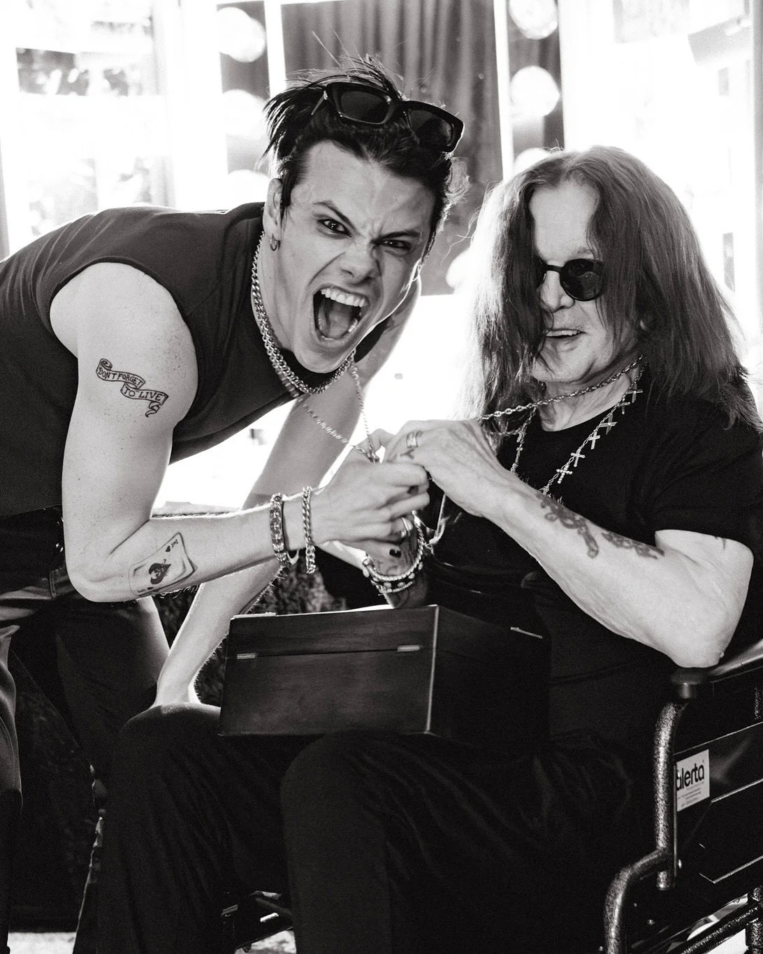 YUNGBLUD and Osbourne holding matching cross chains