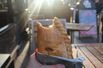 A warm, delicious pastry stuffed with potatoes, onion, and steak. Yum.