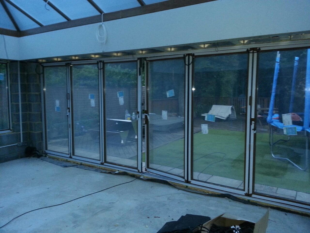 ELECTRIC GLASS FOLDING DOORS - ON.jpg