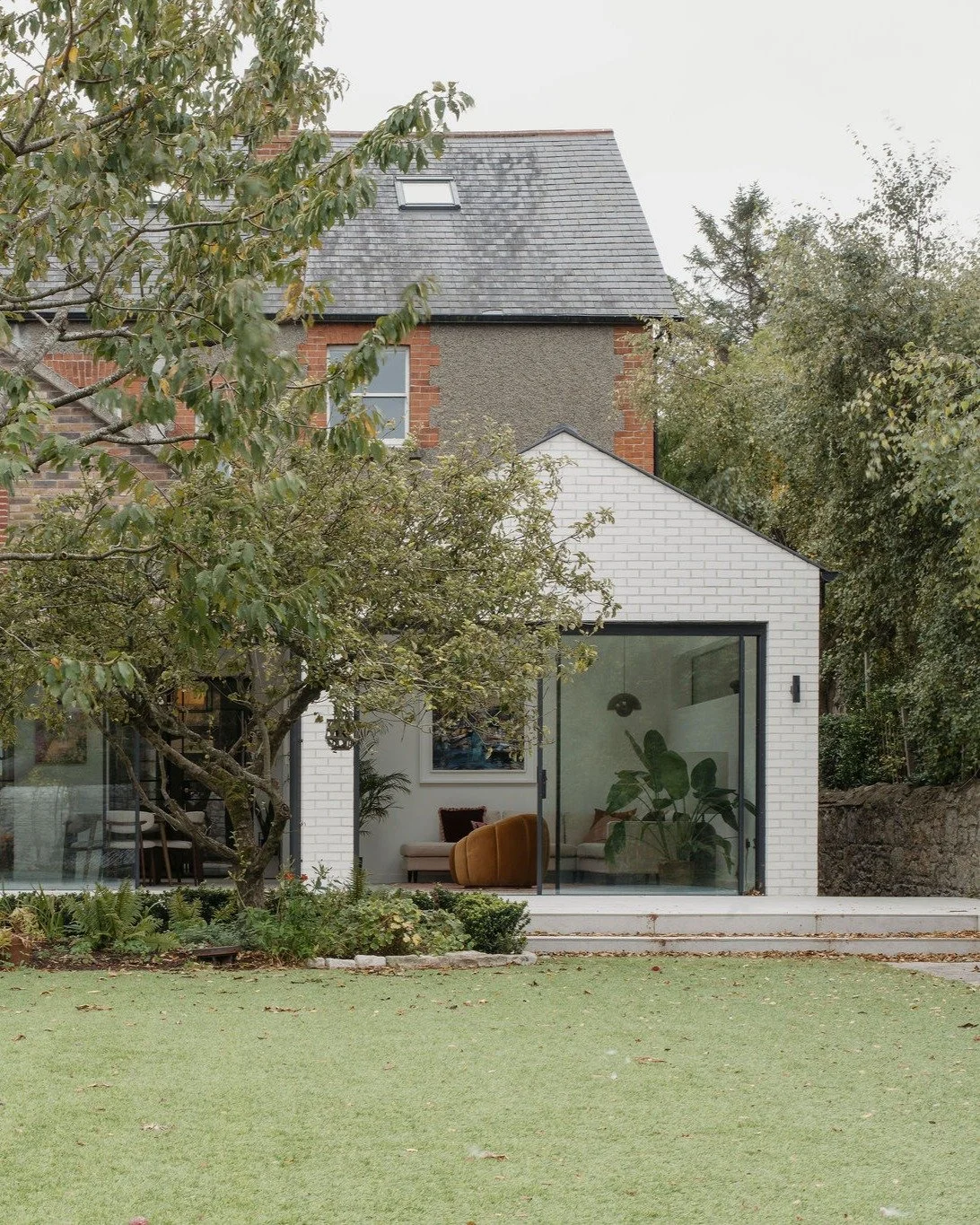 This Edwardian house in Blackrock has been beautifully extended and transformed. A bespoke kitchen and seating area serve as the heart of daily life, creating a seamless connection between spaces and ensuring a natural flow throughout the ground floo