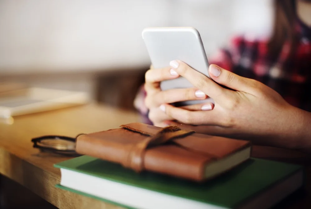 Girl Holding Phone-squashed.jpg