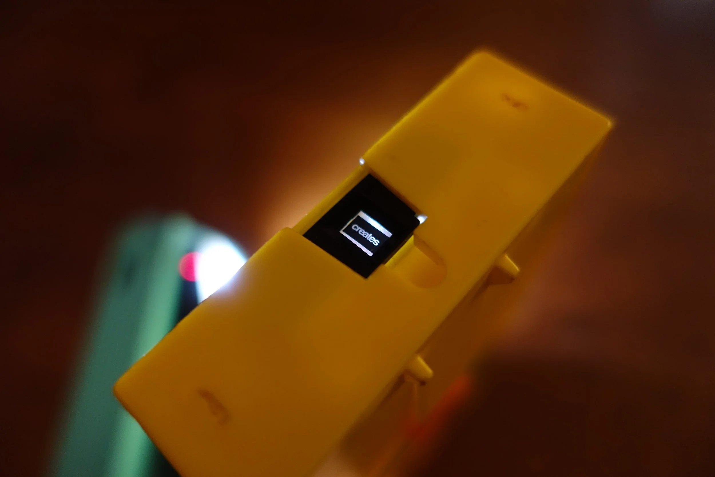  Detail showing light travelling through the film and open gate of the cartridge.  