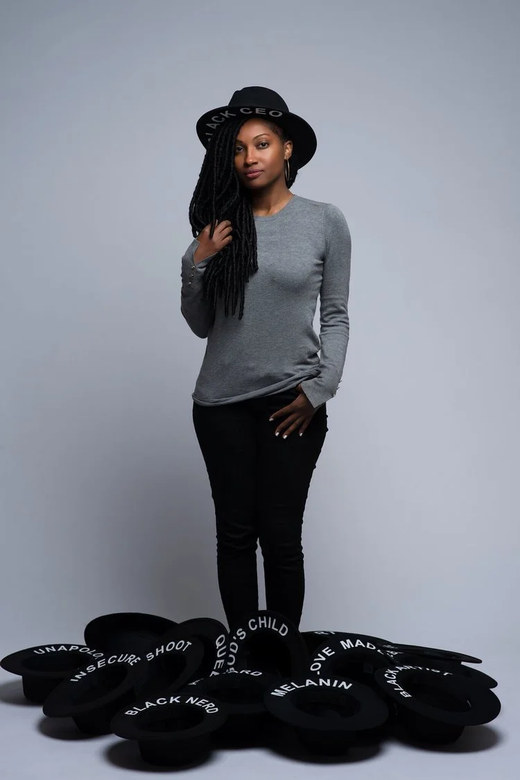 Ritza Cornet pictured with many of her hats! Photo c/o of D. Irwin.